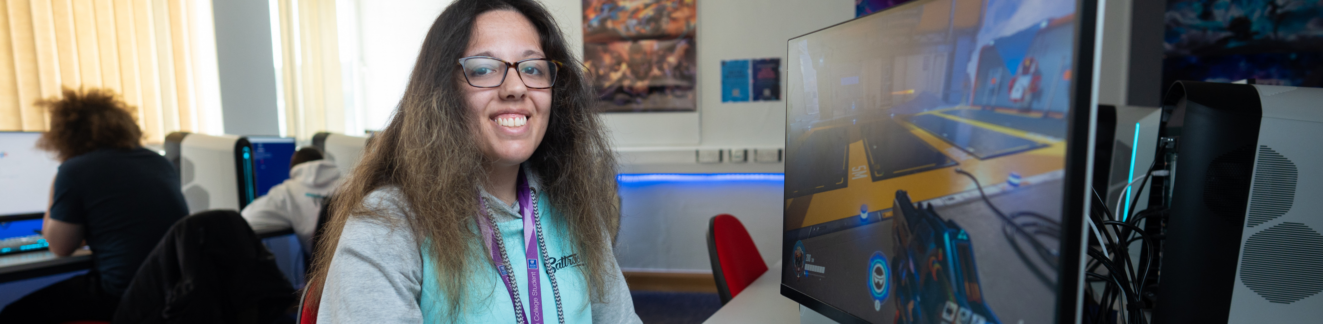 female student sat at computer gaming on esports video game course in weston super mare