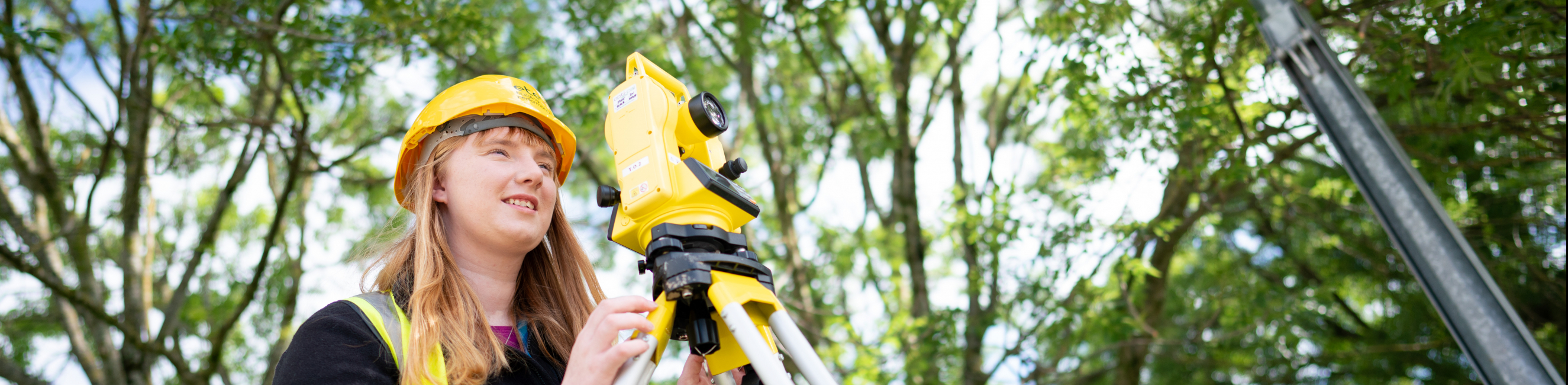 Charlotte using civil engineering equipment outside