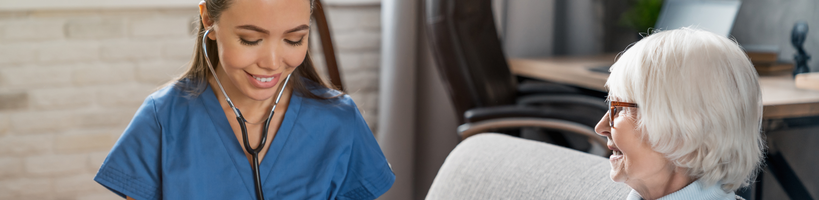 Nurse checking blood pressure of patient
