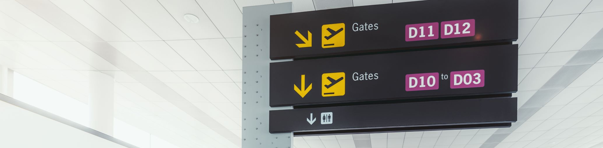Airport signage, with gate information displayed