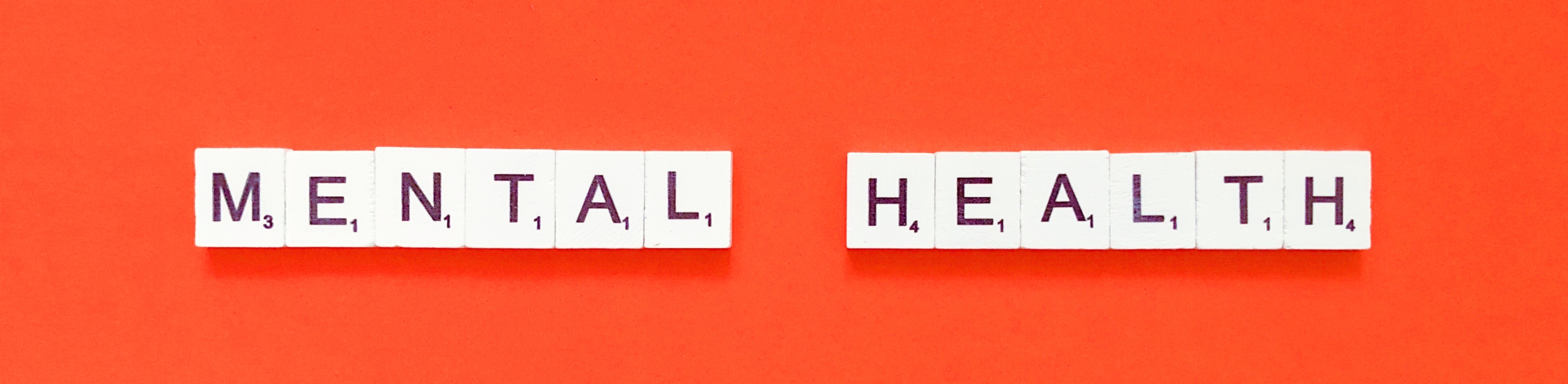 Mental Health spelt out in Scrabble pieces