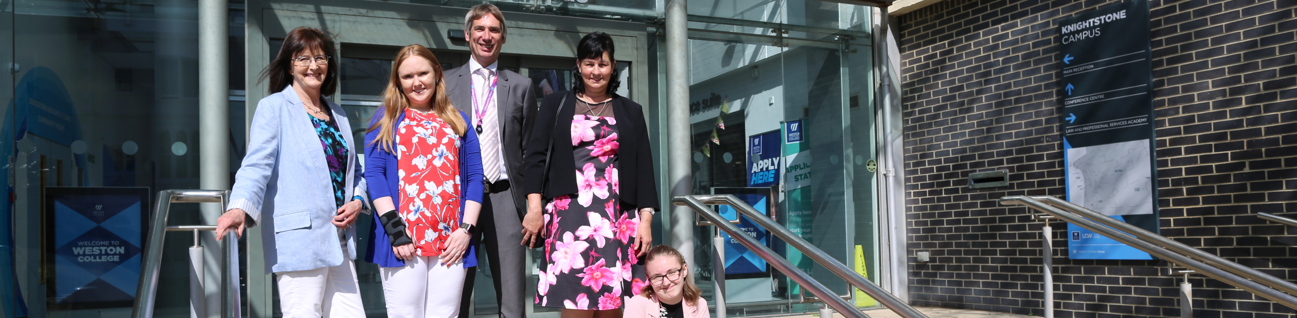 Learners, parents and teacher outside Knightstone campus