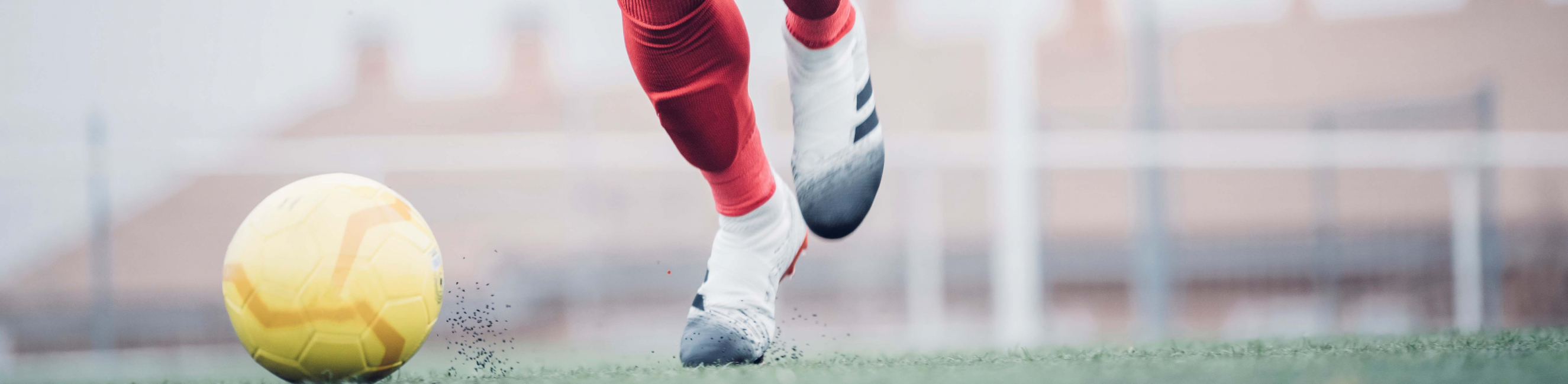 Football player kicking a football