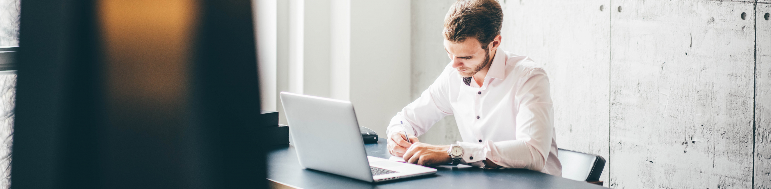Man attending virtual course on his laptop