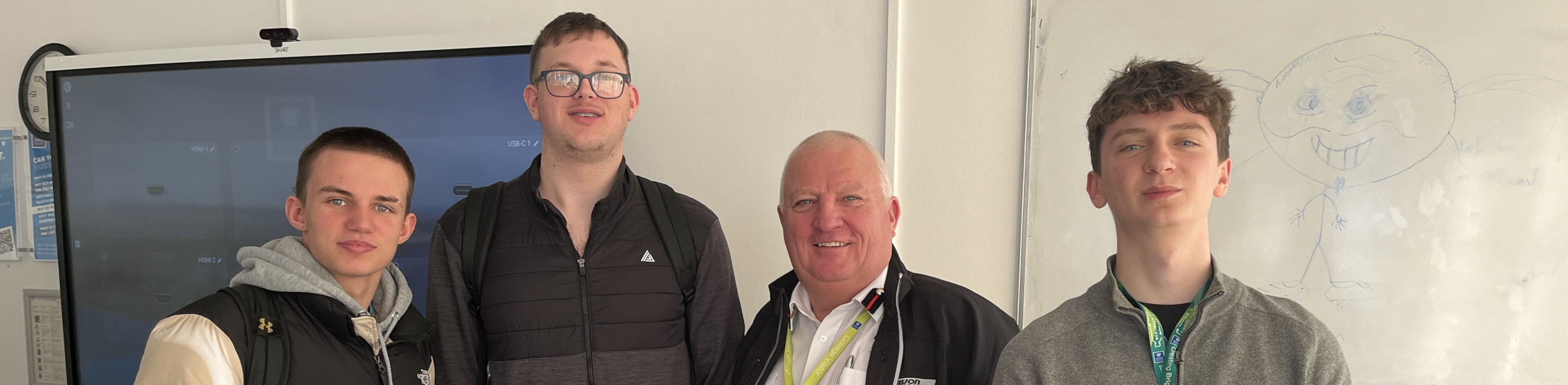 Fire officer Rich standing with students. 