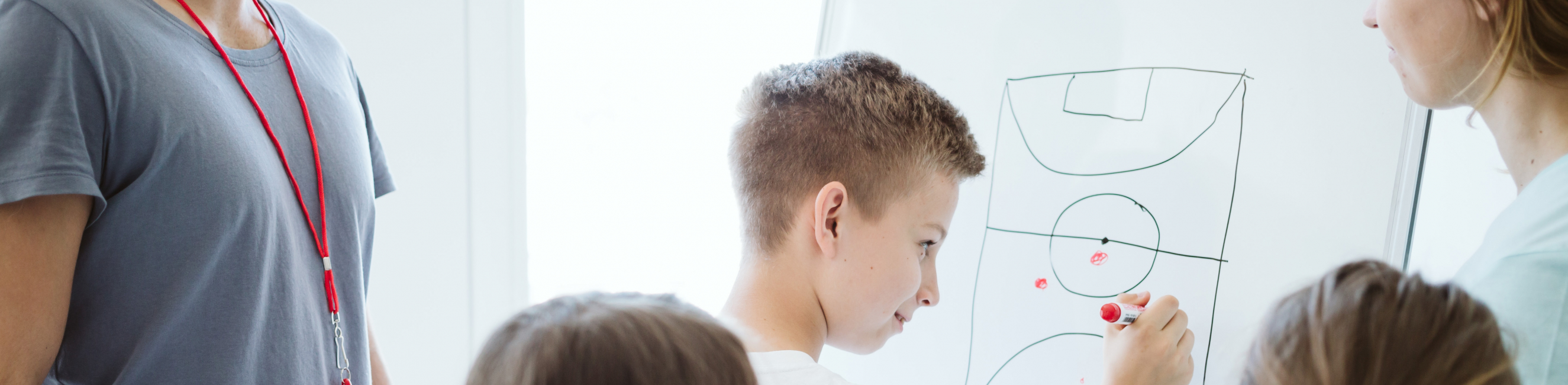 Young boy planning sports tactics