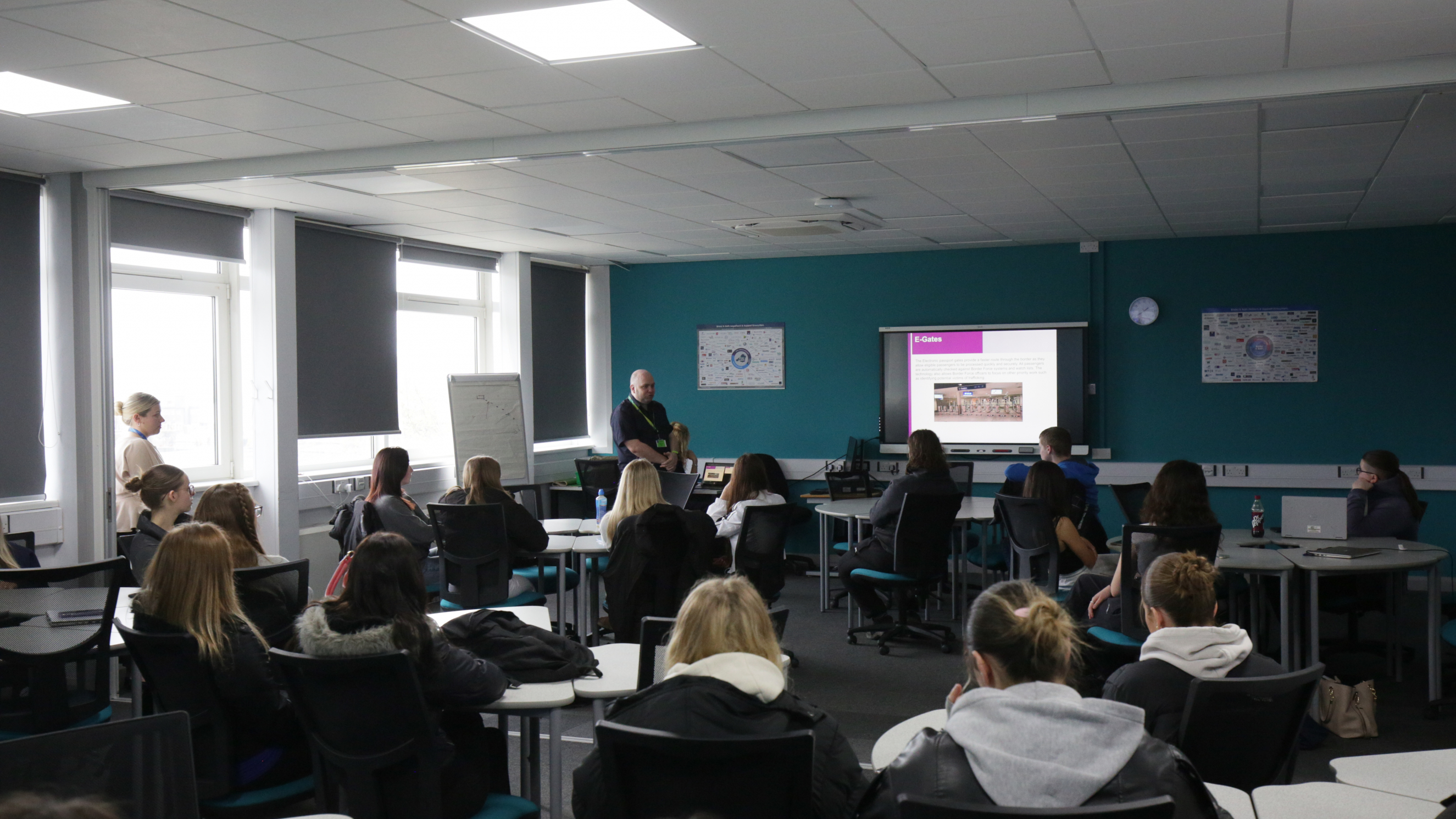travel and tourism students receiving a lecture from the border force