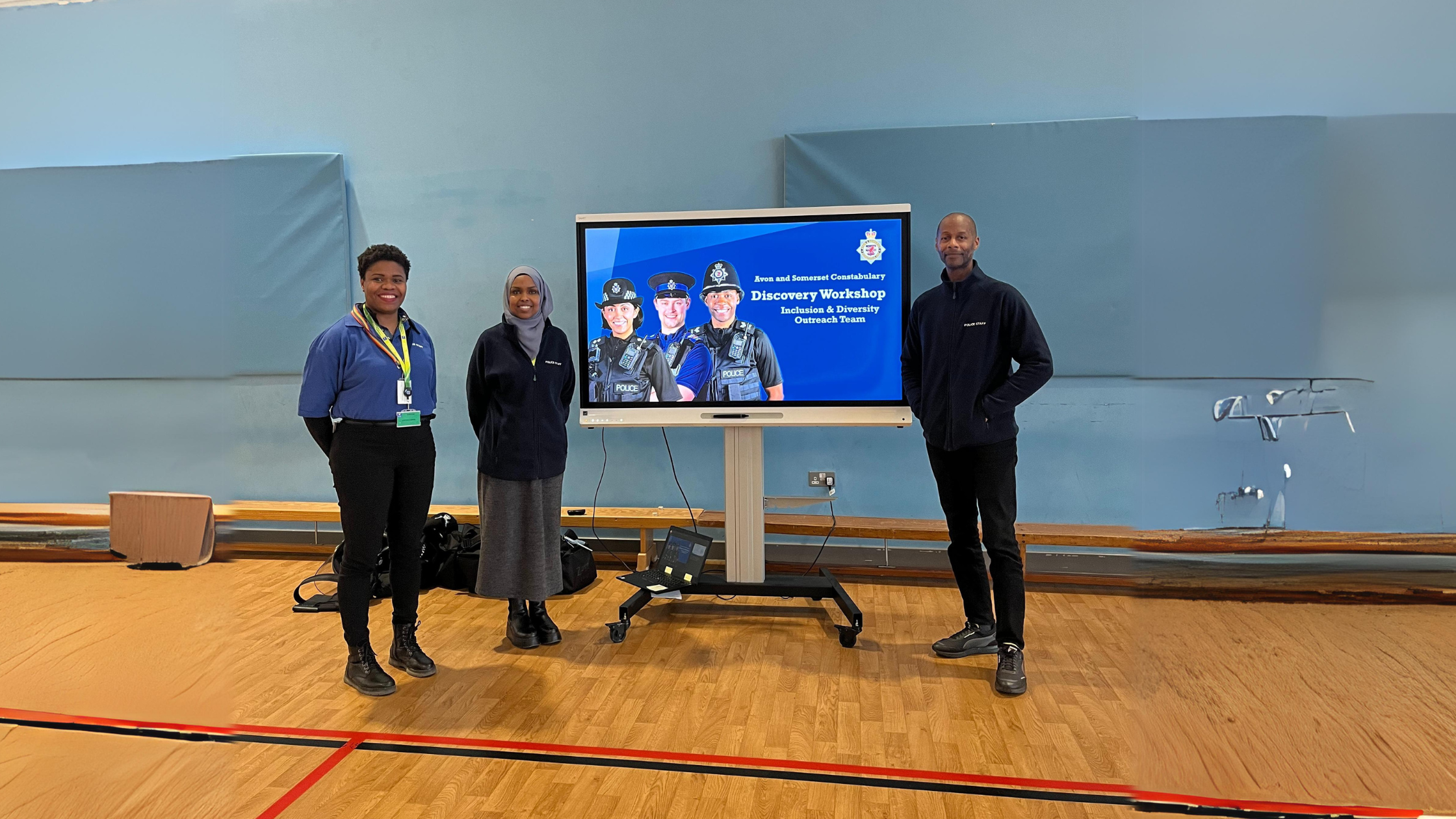 the police outreach team standing in front of their presentation