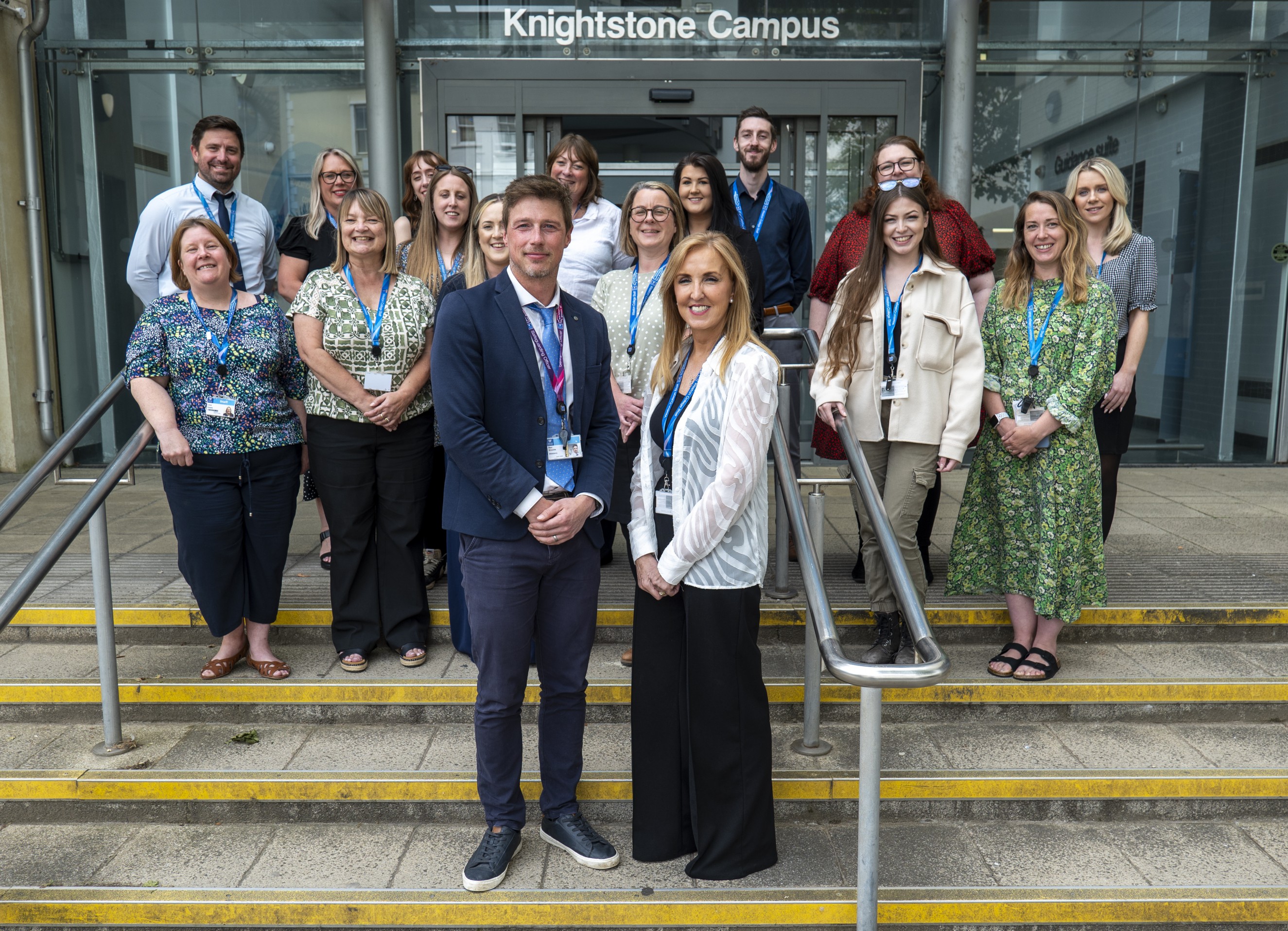 Staff gathered together in front of Knightstone celebrating the matrix accreditation