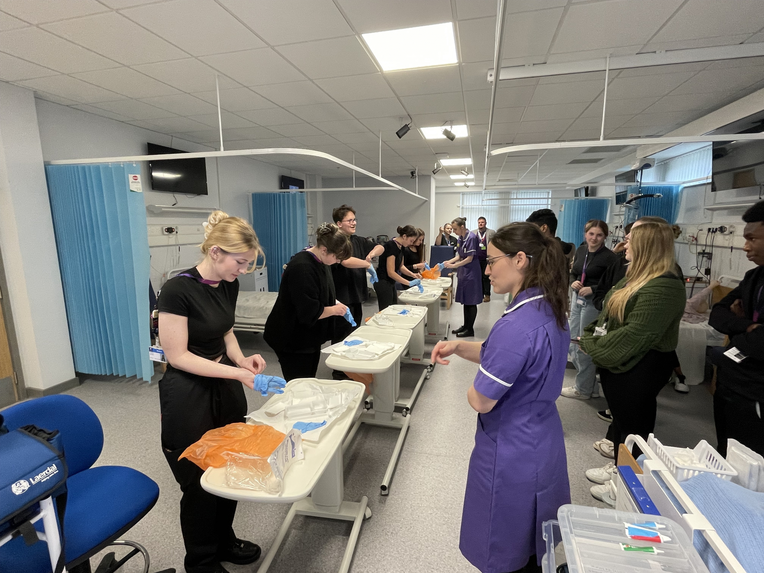 Learners practicing how to open bandages properly