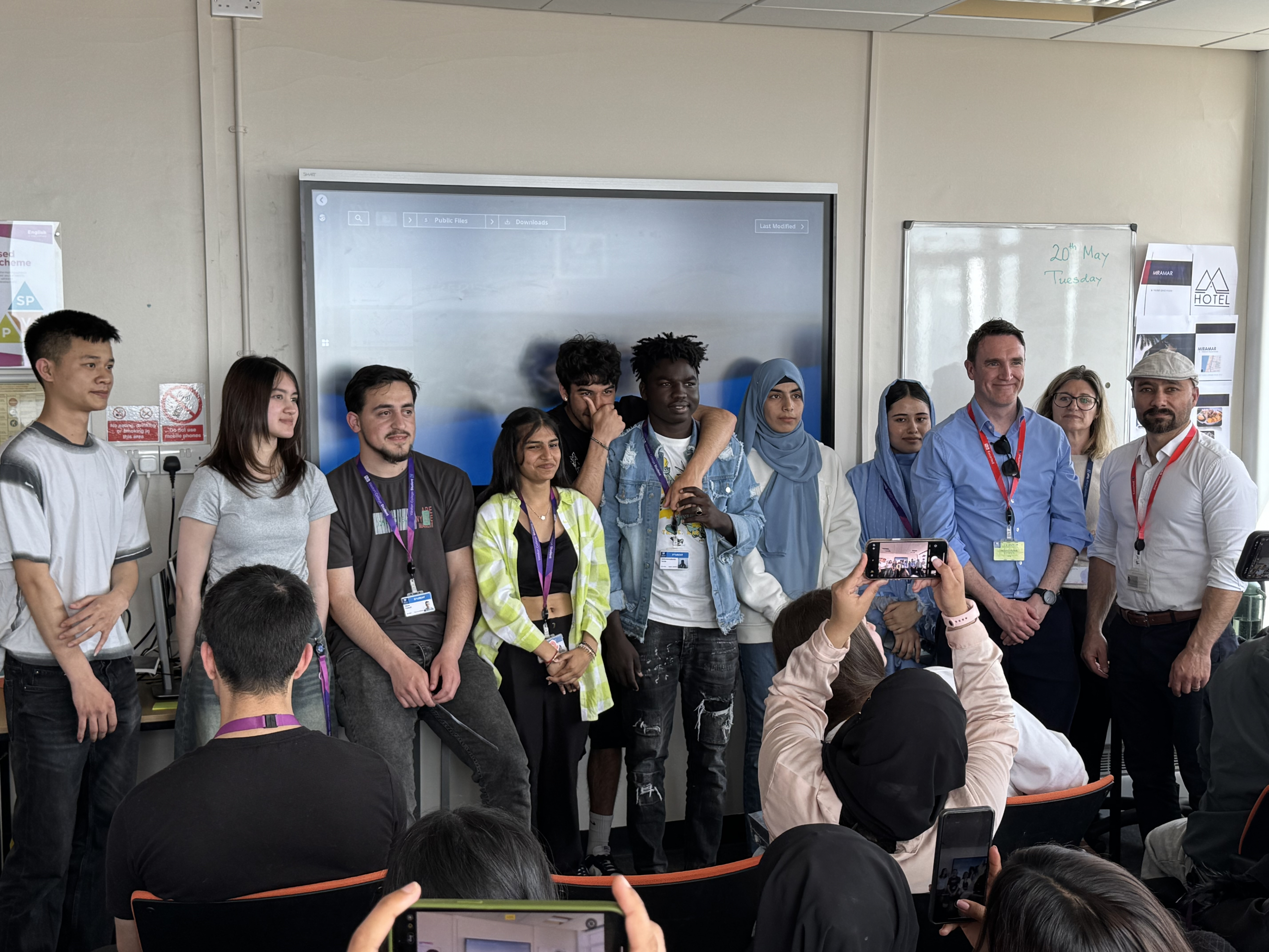ESOL Students and panel smiling