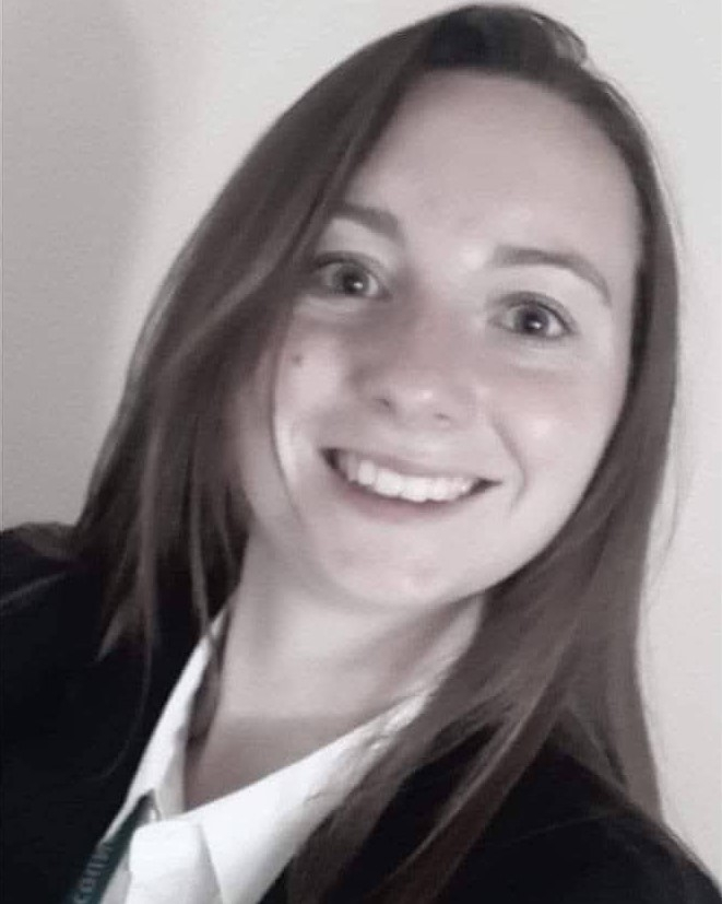 Claire smiling at the camera