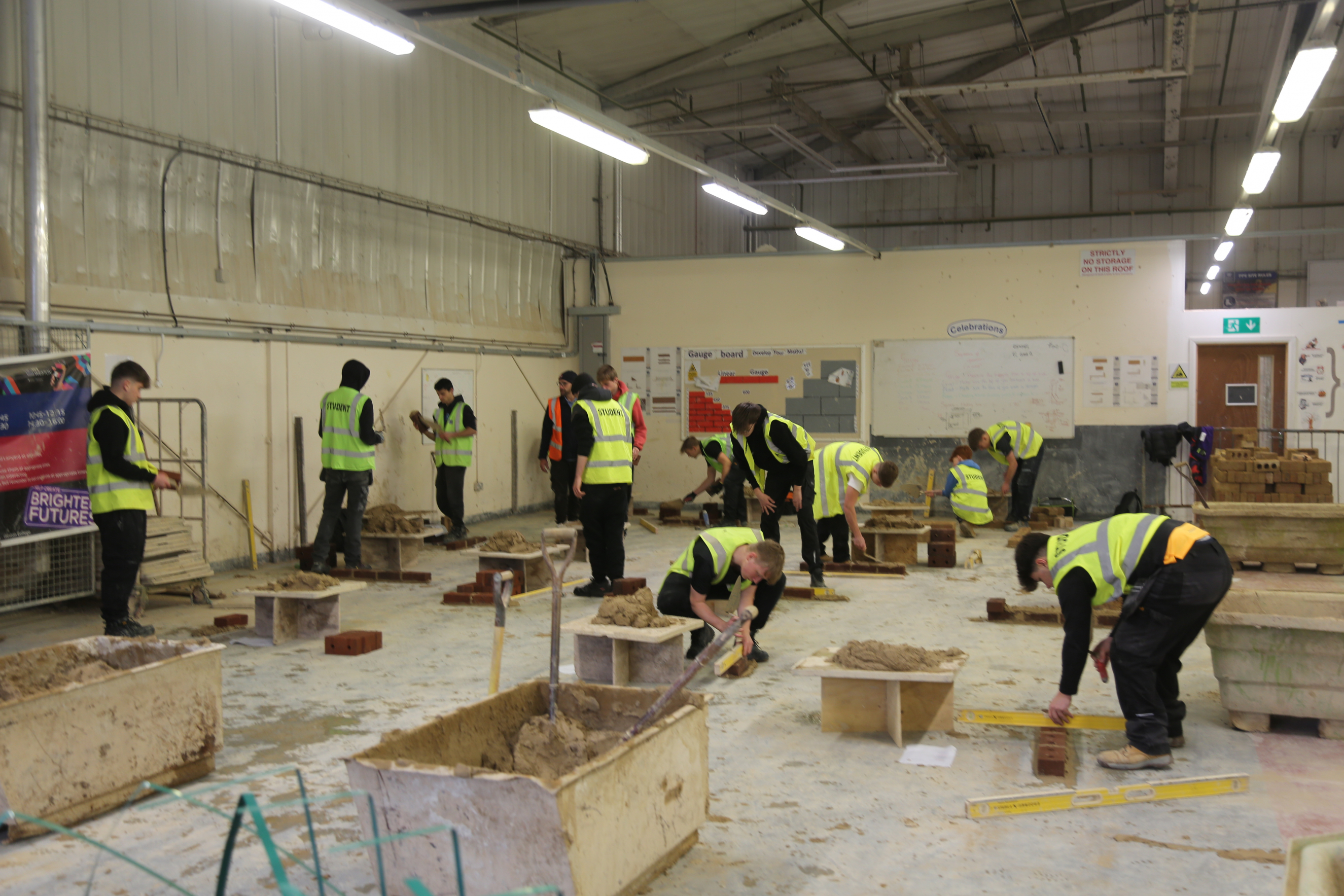 Students practicing bricklaying in the South West Skills brickwork workshop