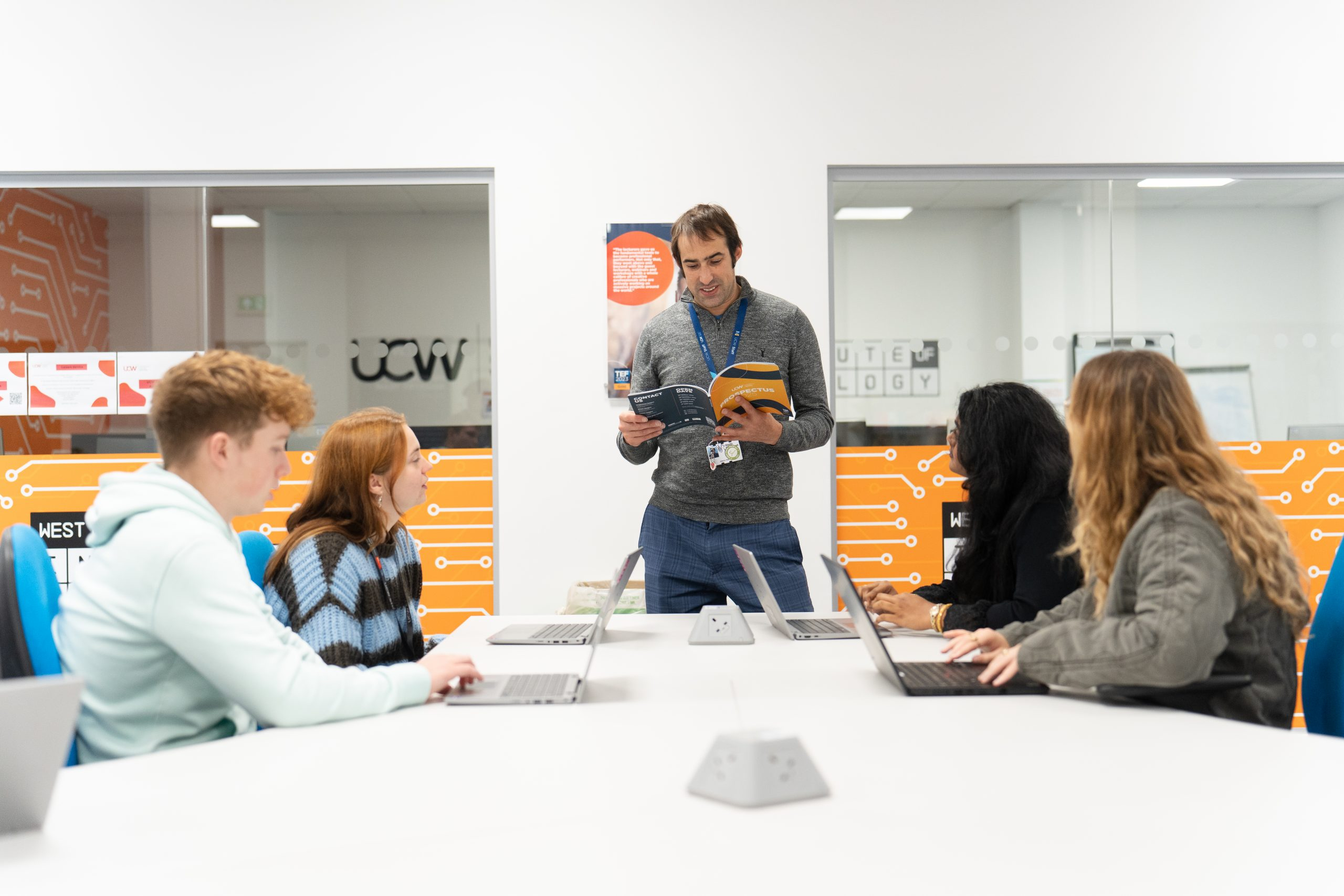 Lecturer discussing UCW