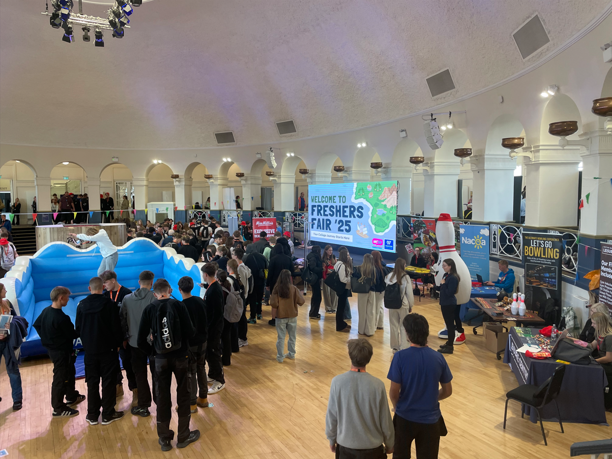 Students interact with stand at Freshers' Fair