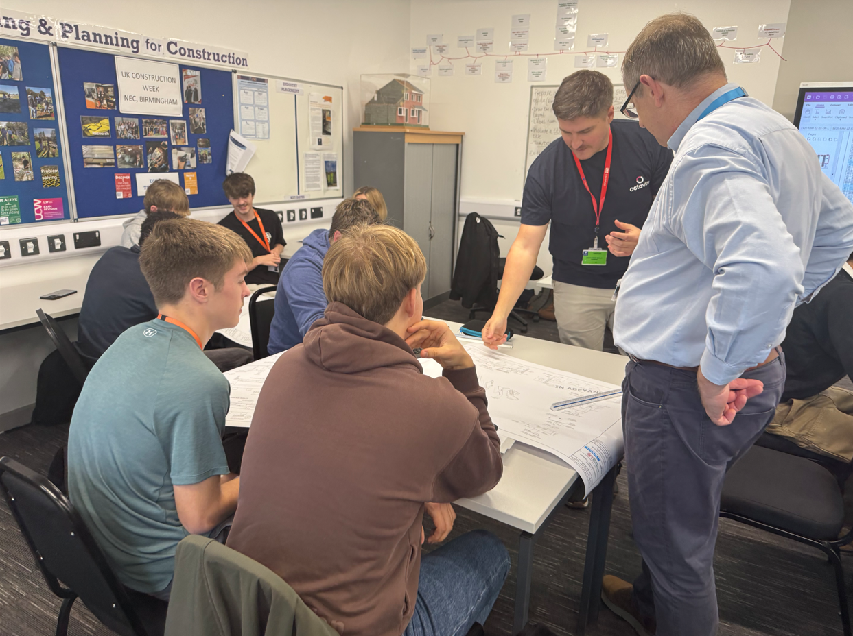 Students talking to Ben about their plans for the bridge