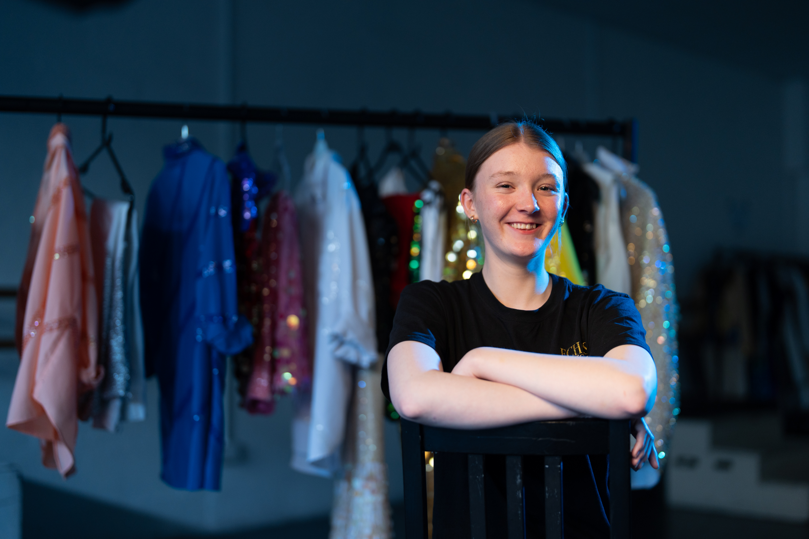 Performing Arts learner crossing her arms in front of wardrobe