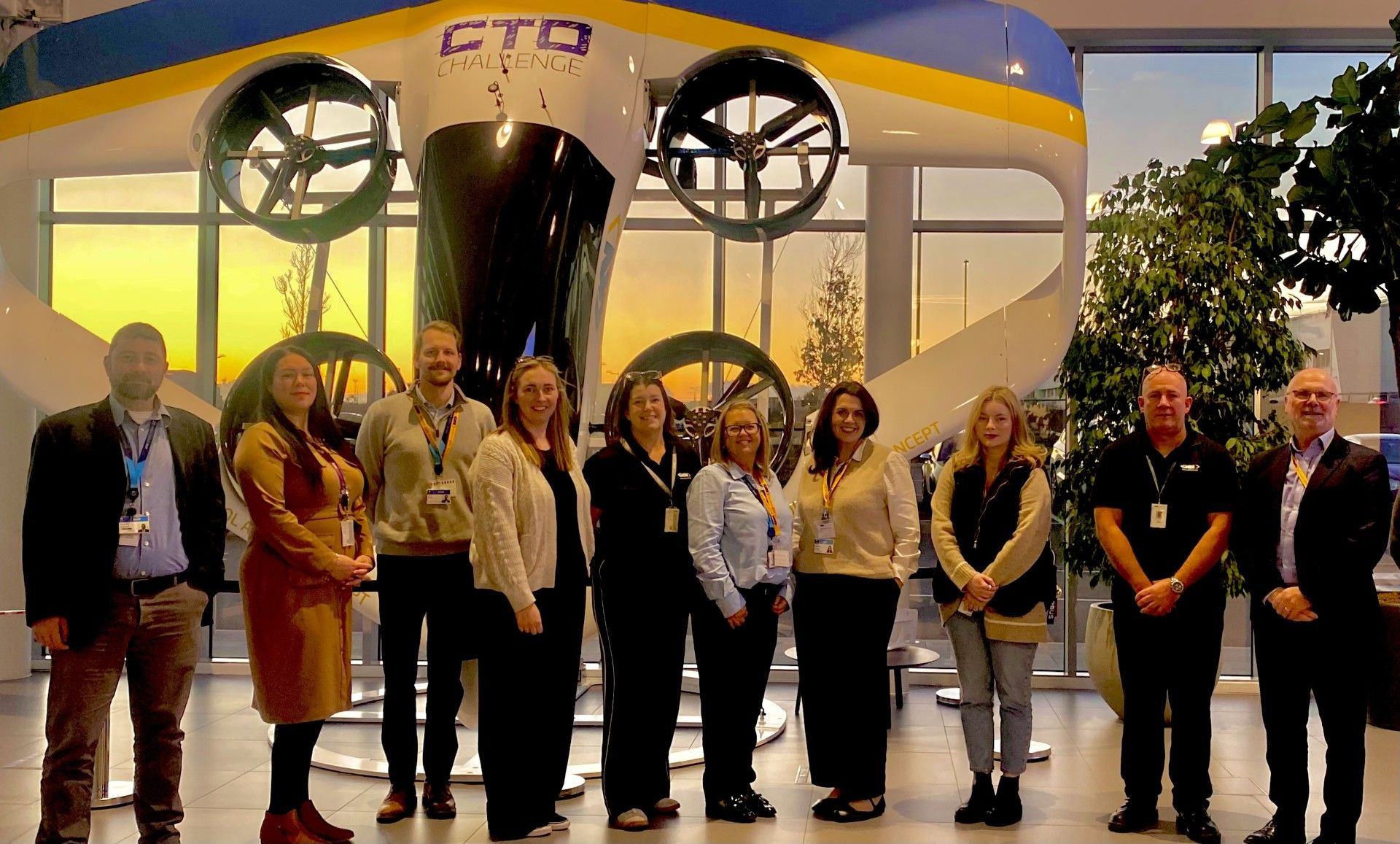 Staff at GKN Aerospace Stood in front of Sunrise