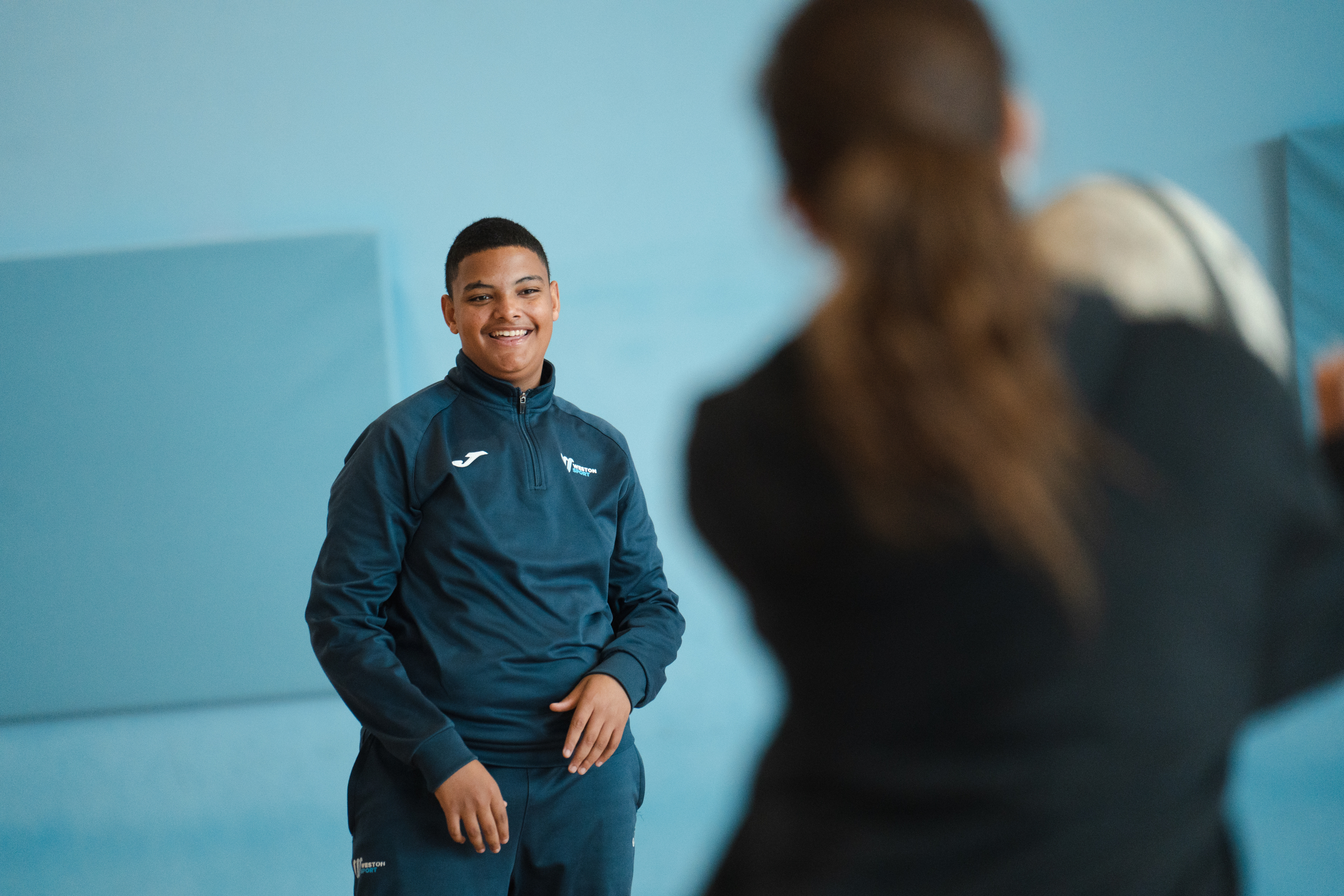 Sport student catching a rugby ball