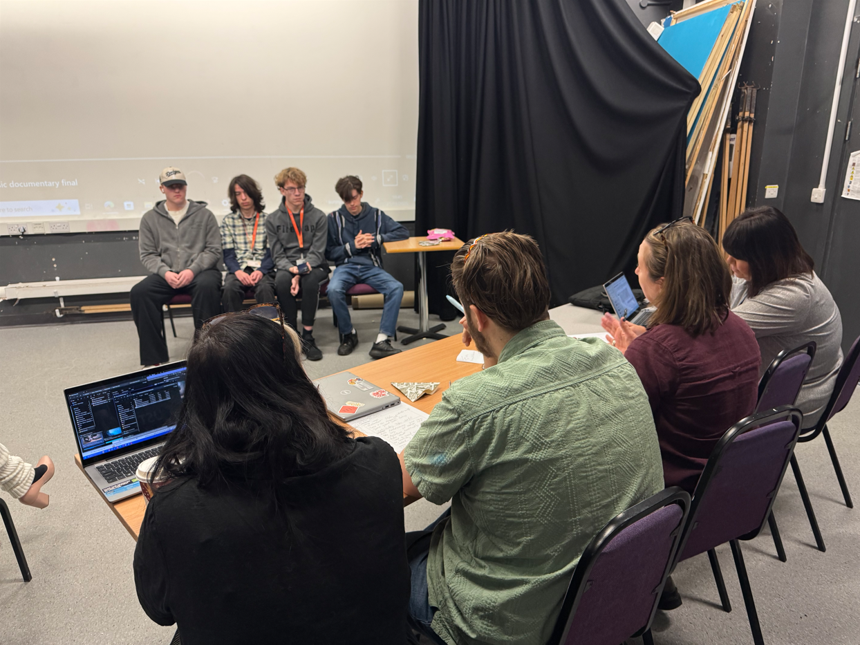 Media lecturers giving feedback to students