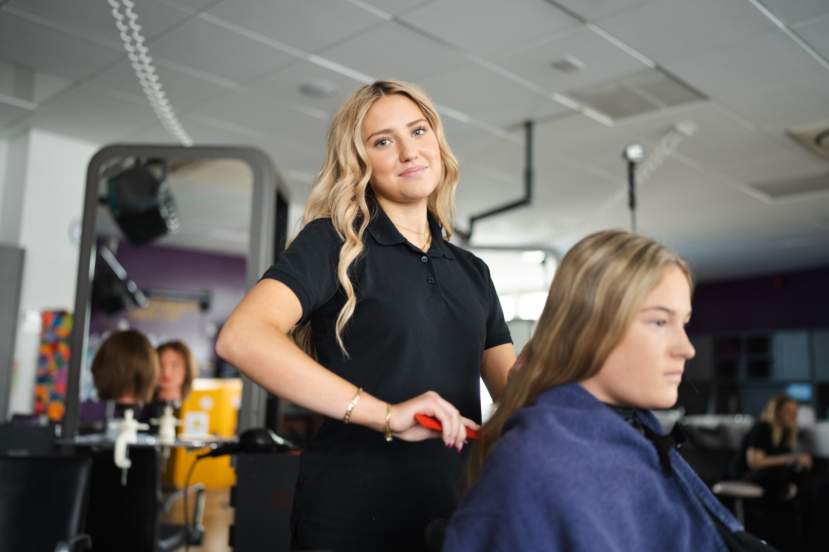 Hair and Beauty learner smiling at the camera