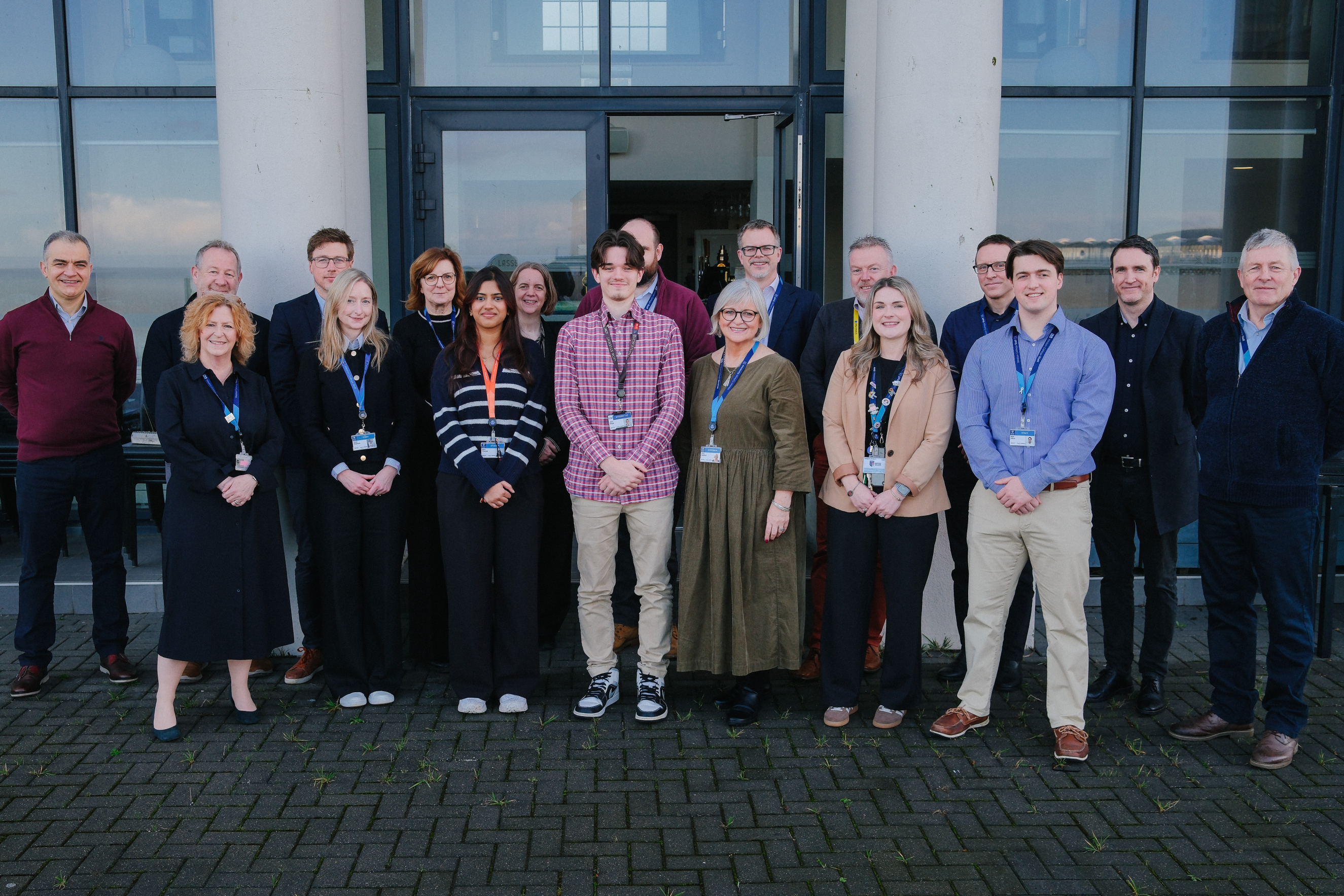 Staff and students stood outside the Winter Gardens smiling