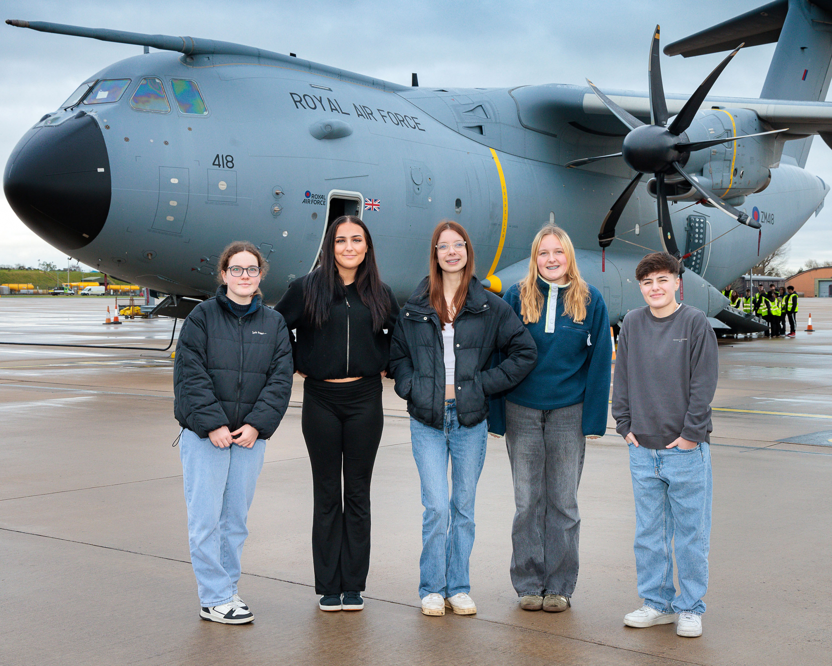 Students standing in front of a RAF plane