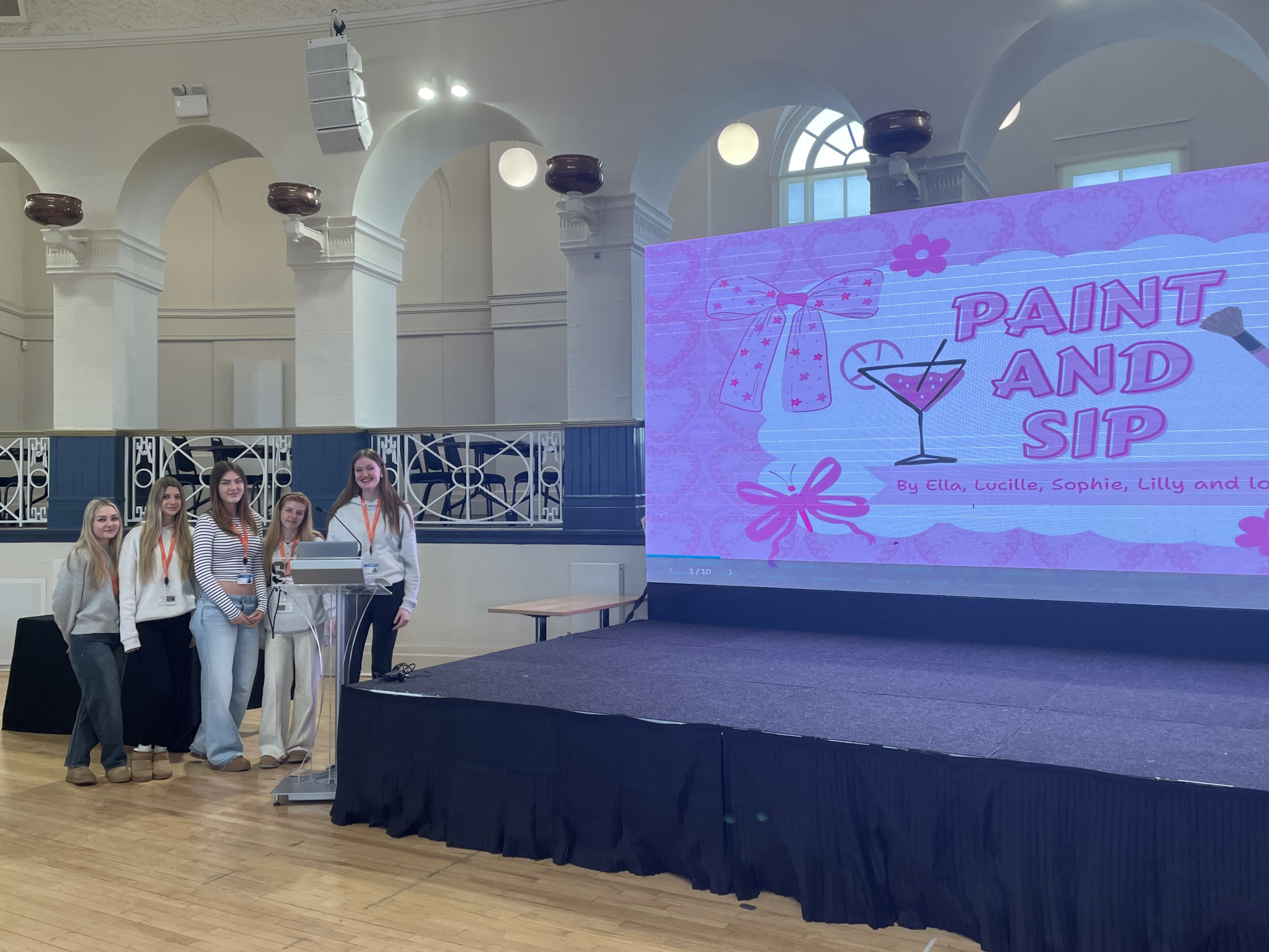 Students standing next to their pitch idea