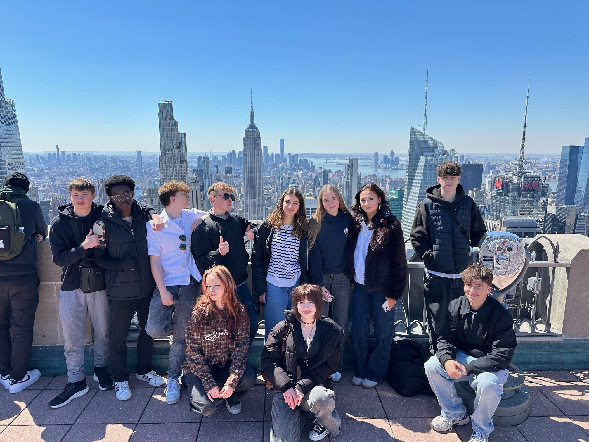 Students standing in front of the skyline