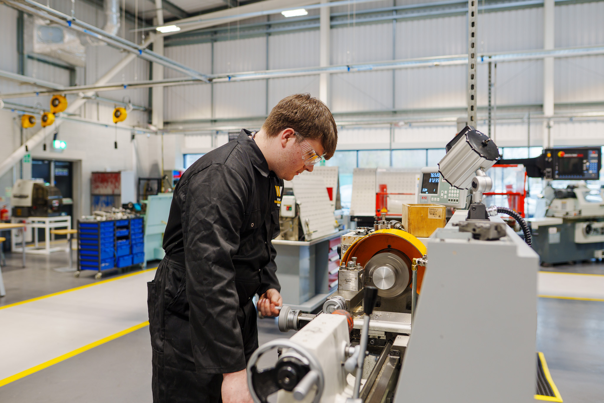 Student using manufacturing machine