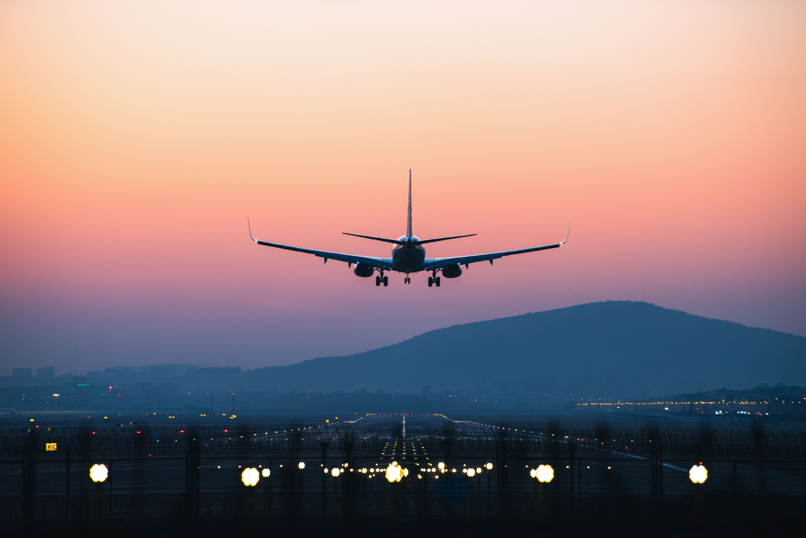 Plane taking off in the sunset