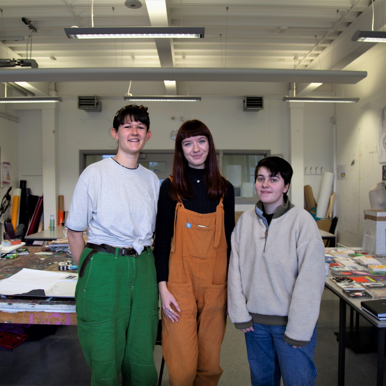 Students smiling in art studio