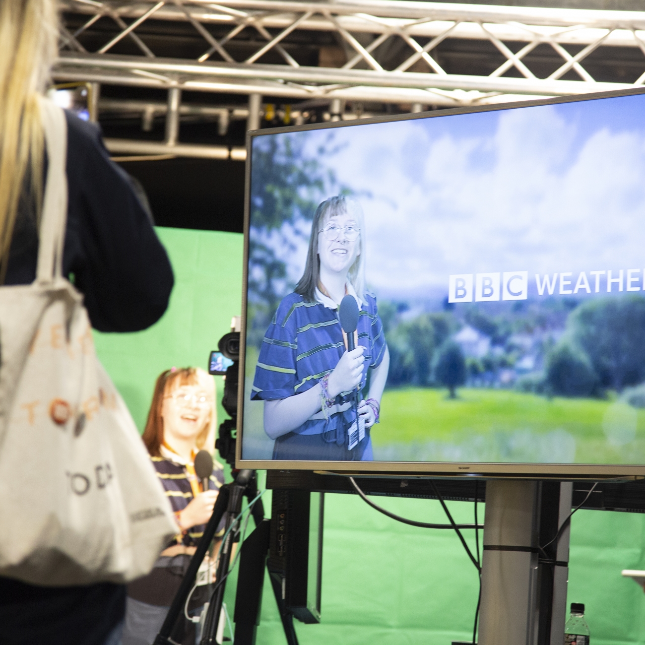 students presenting the weather at careers convention