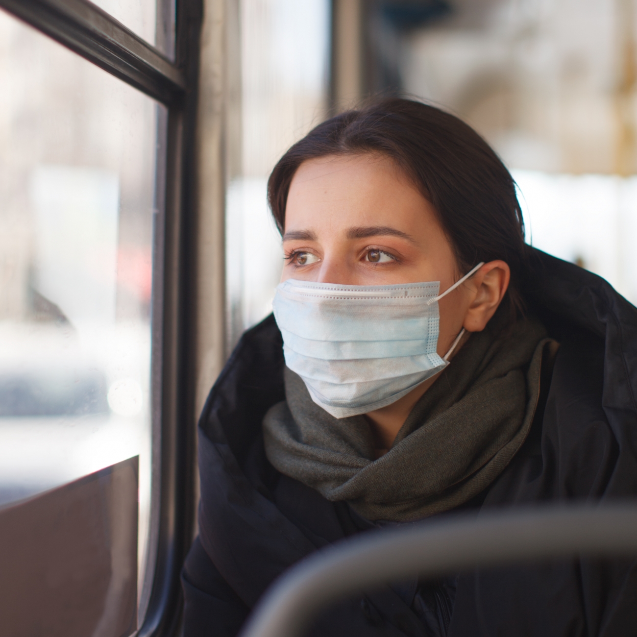 female student looking out of bus window in weston-super-mare traveling to weston college