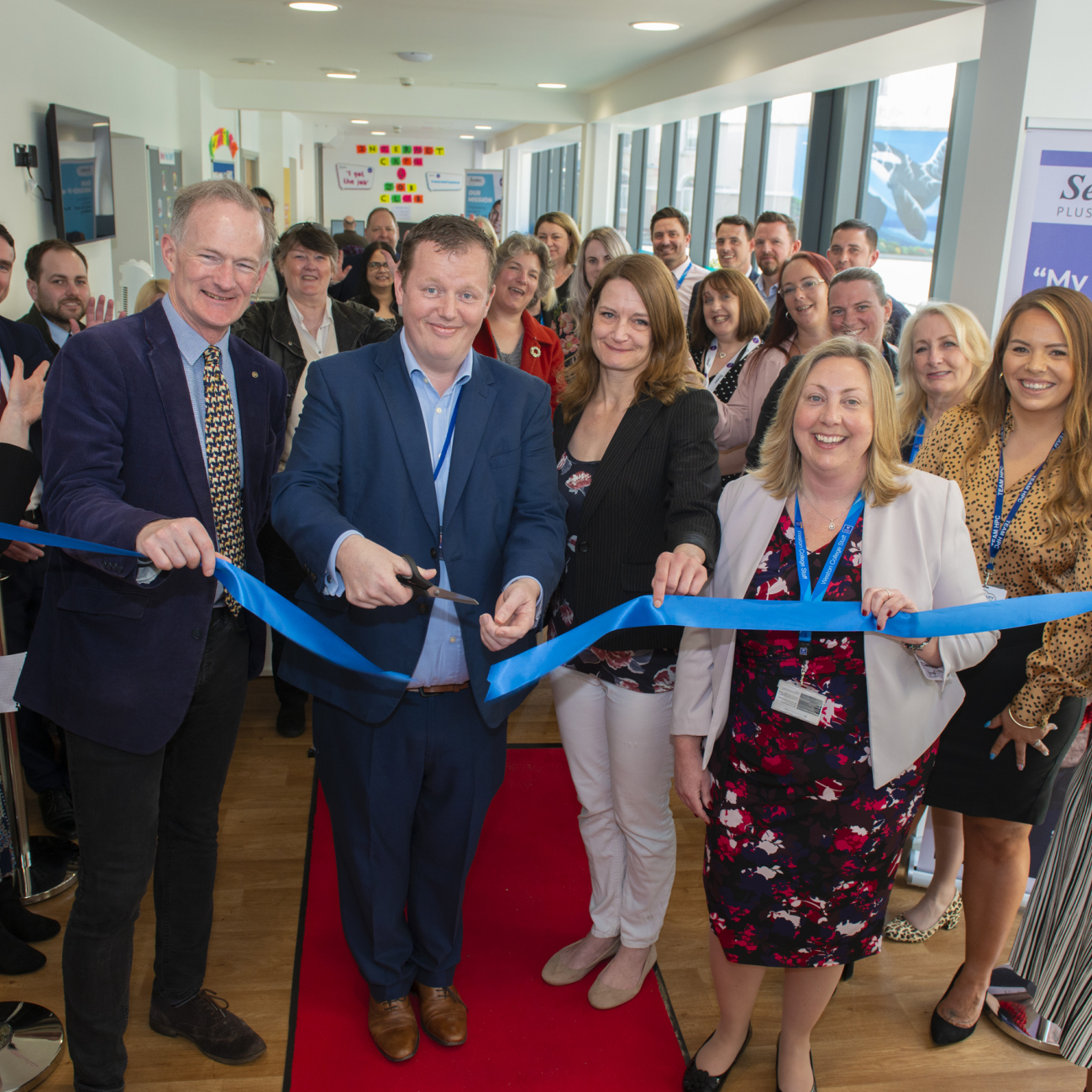 John Penrose, Drew Smith, Jenny Harrison and Jo Watson cutting ribbon