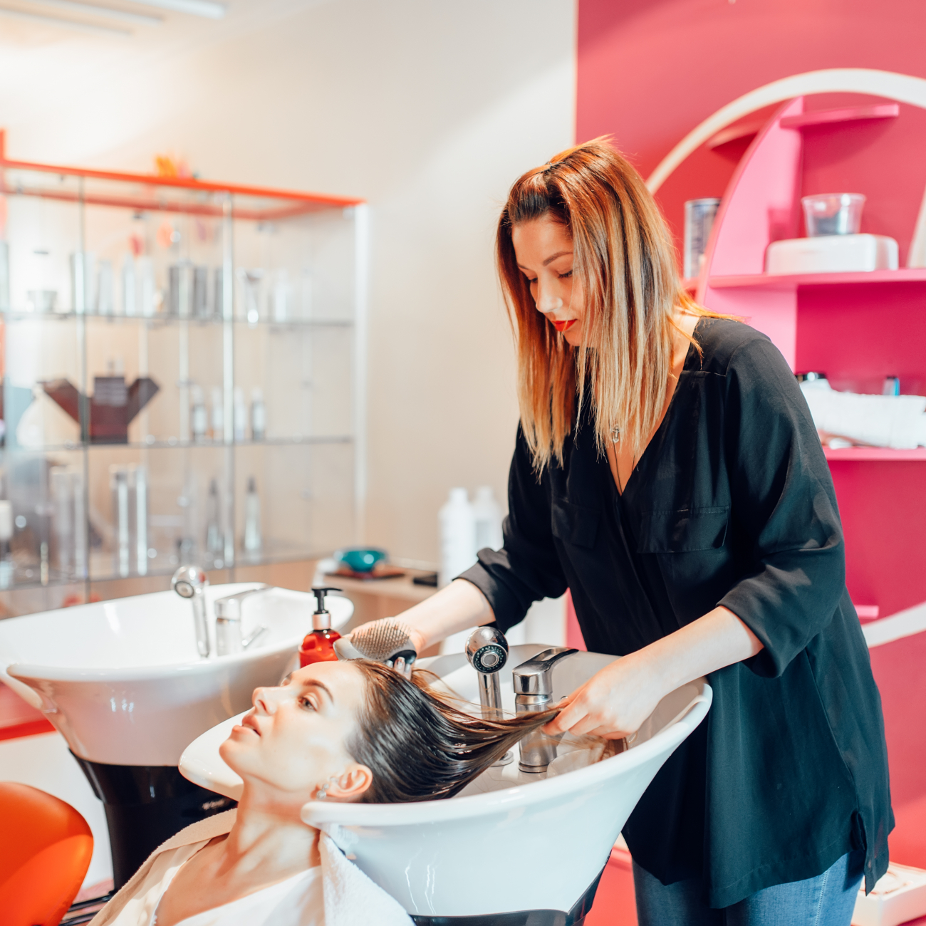 Lady receiving hair wash in salon
