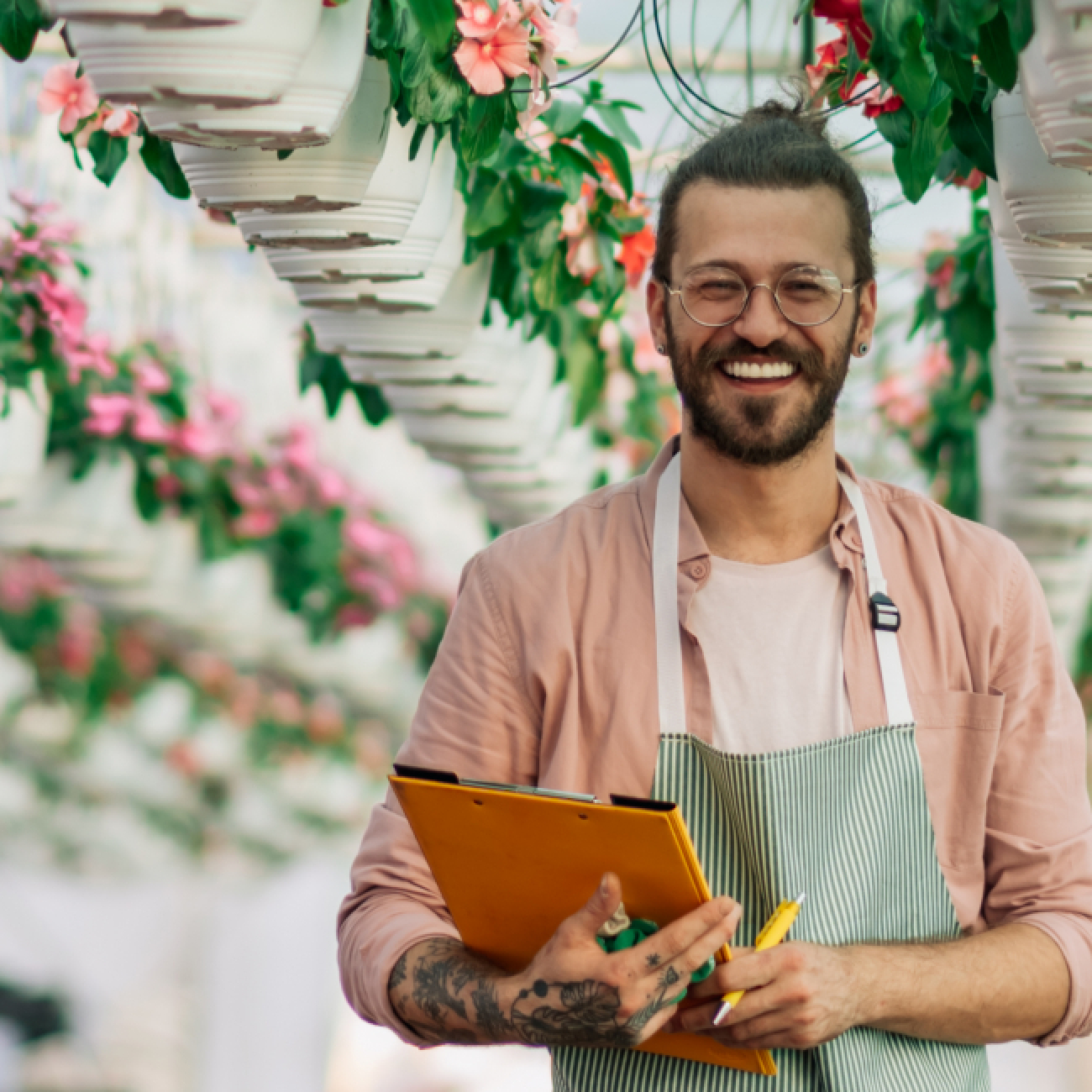 Smiling man holding clipboard