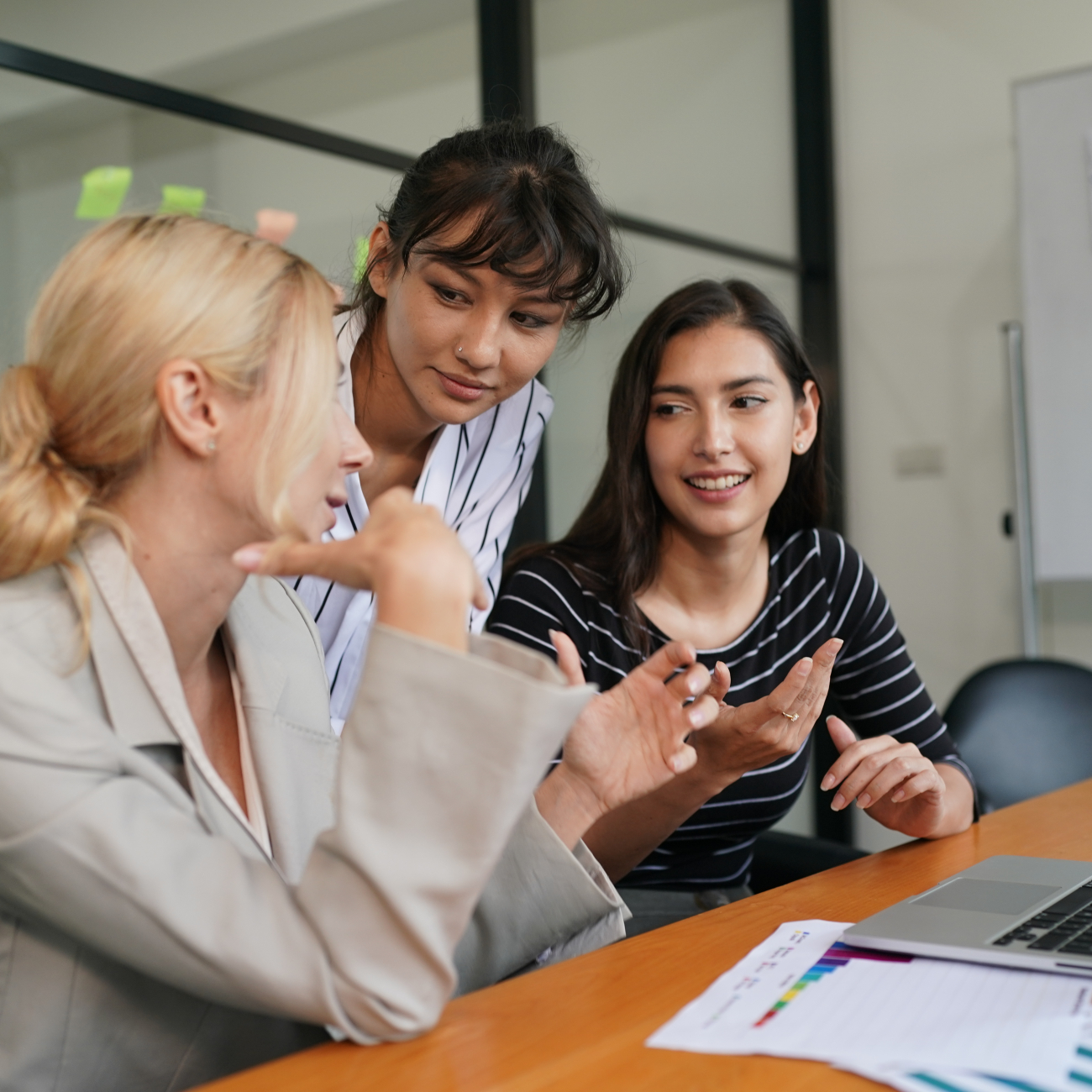 Women in boardroom working as a team