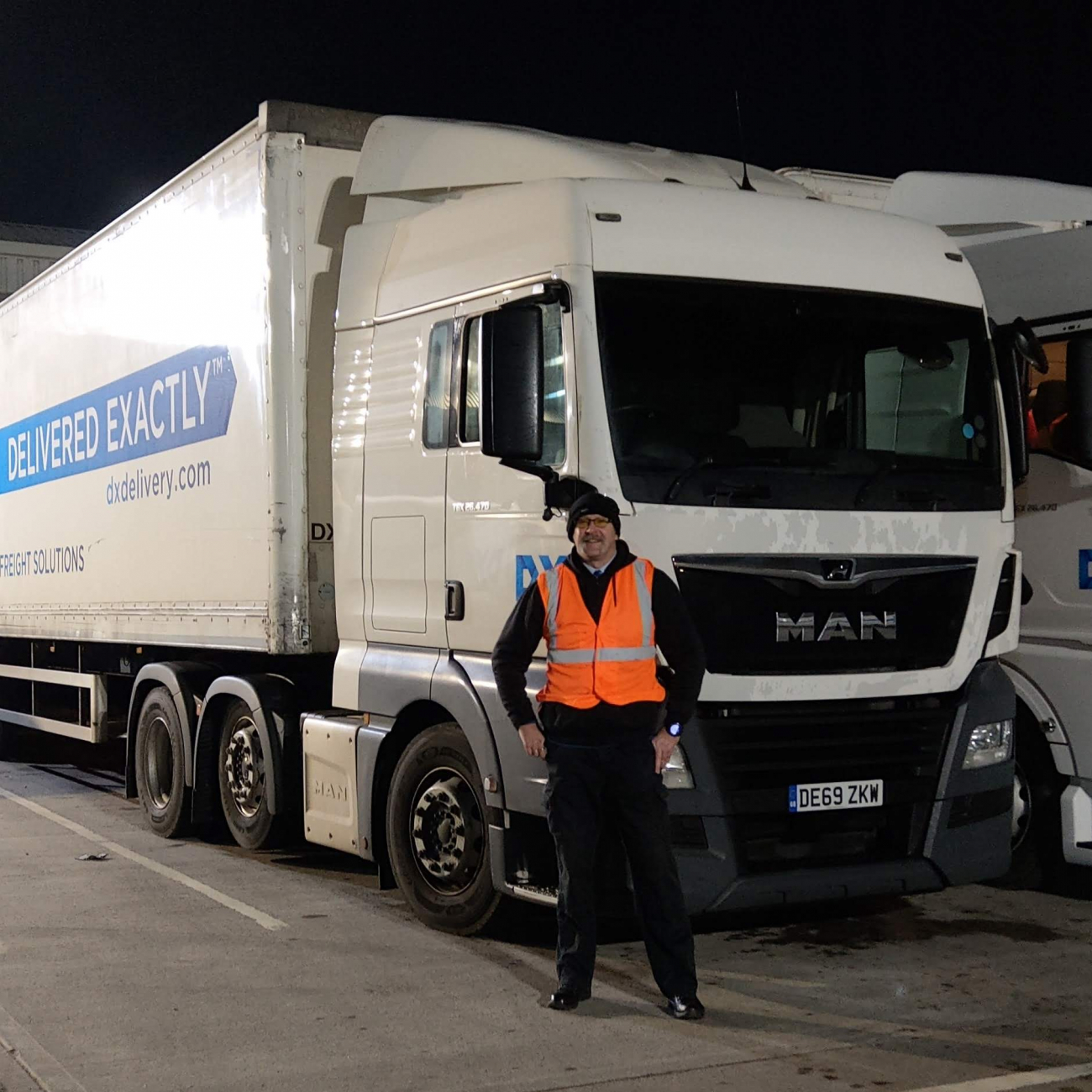 Jonathan stood in front of his lorry