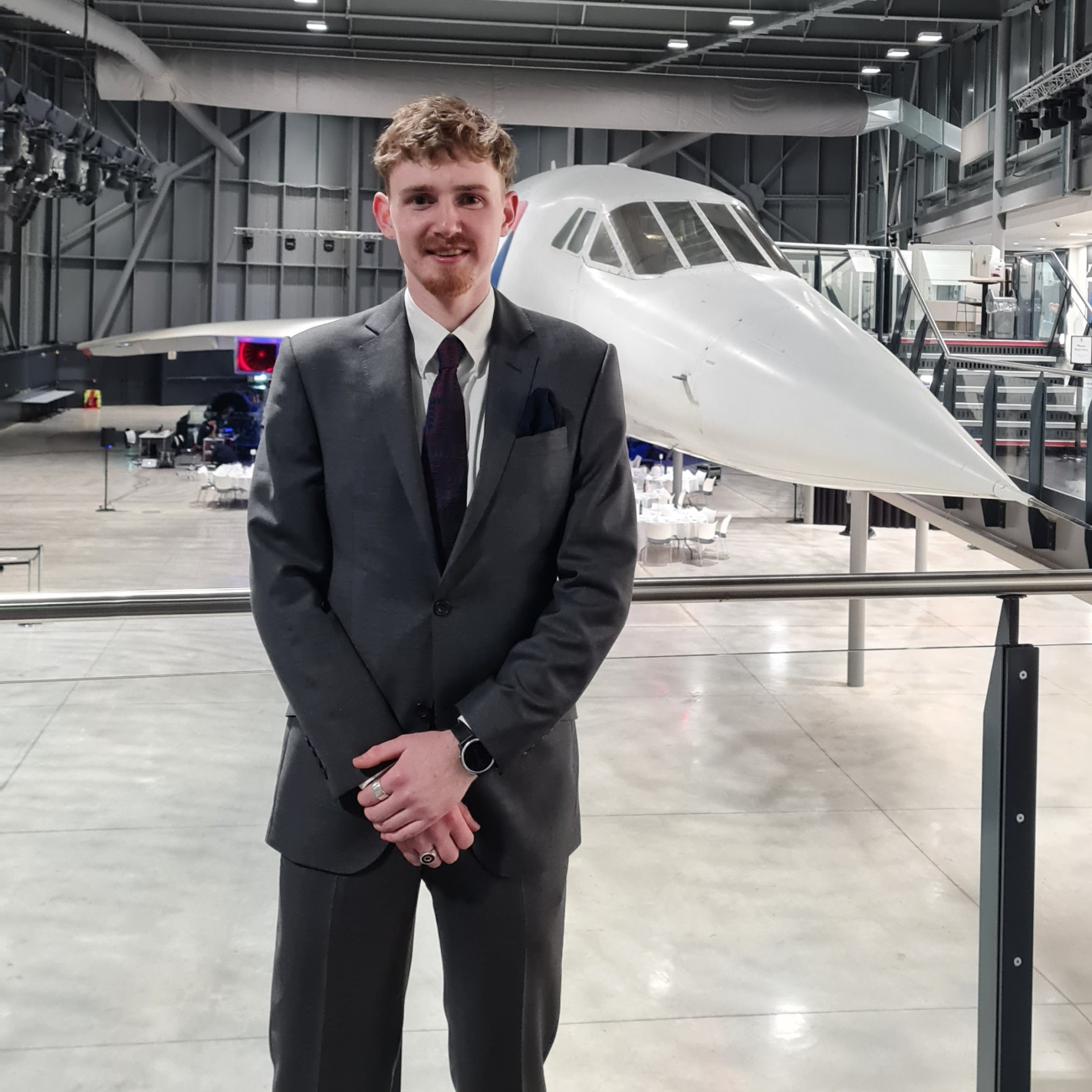 Bede standing in front of airplane at Airbus