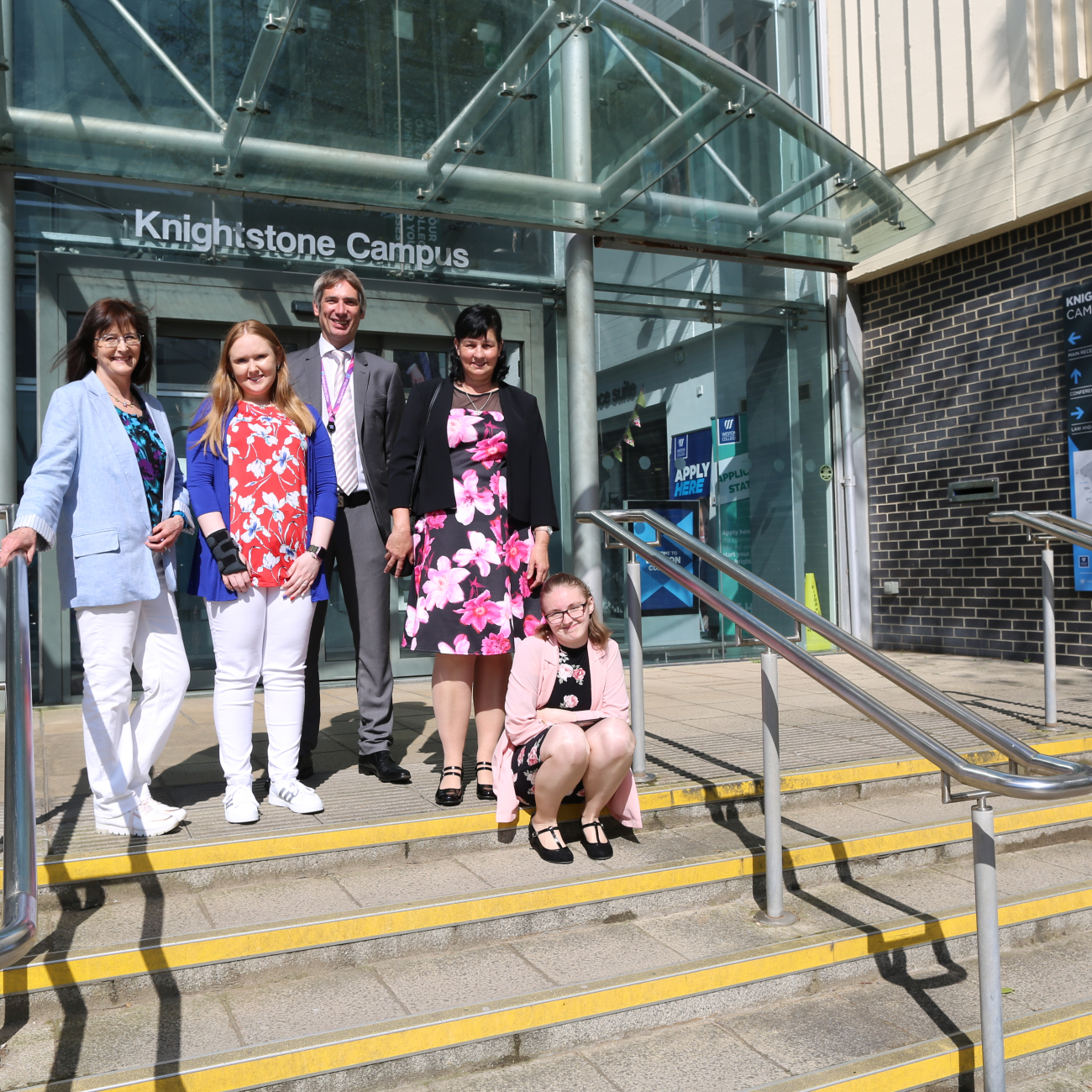 Learners, parents and teacher outside Knightstone campus