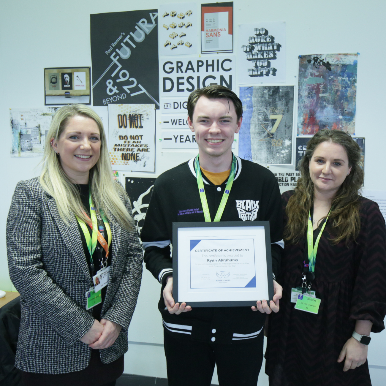 Logo designer Ryan stands with his certificate and representatives from North Somerset Council