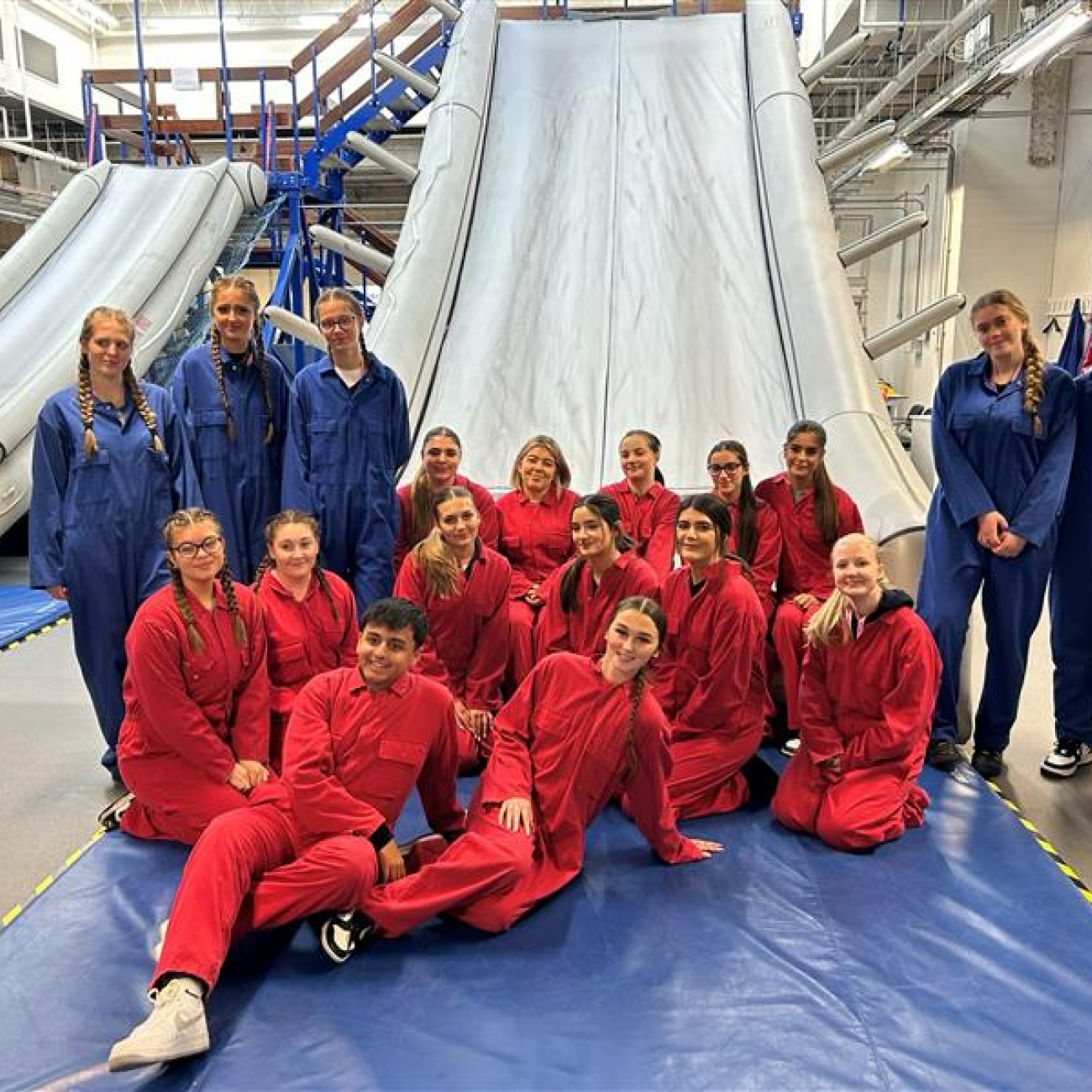 Learners at bottom of escape slide