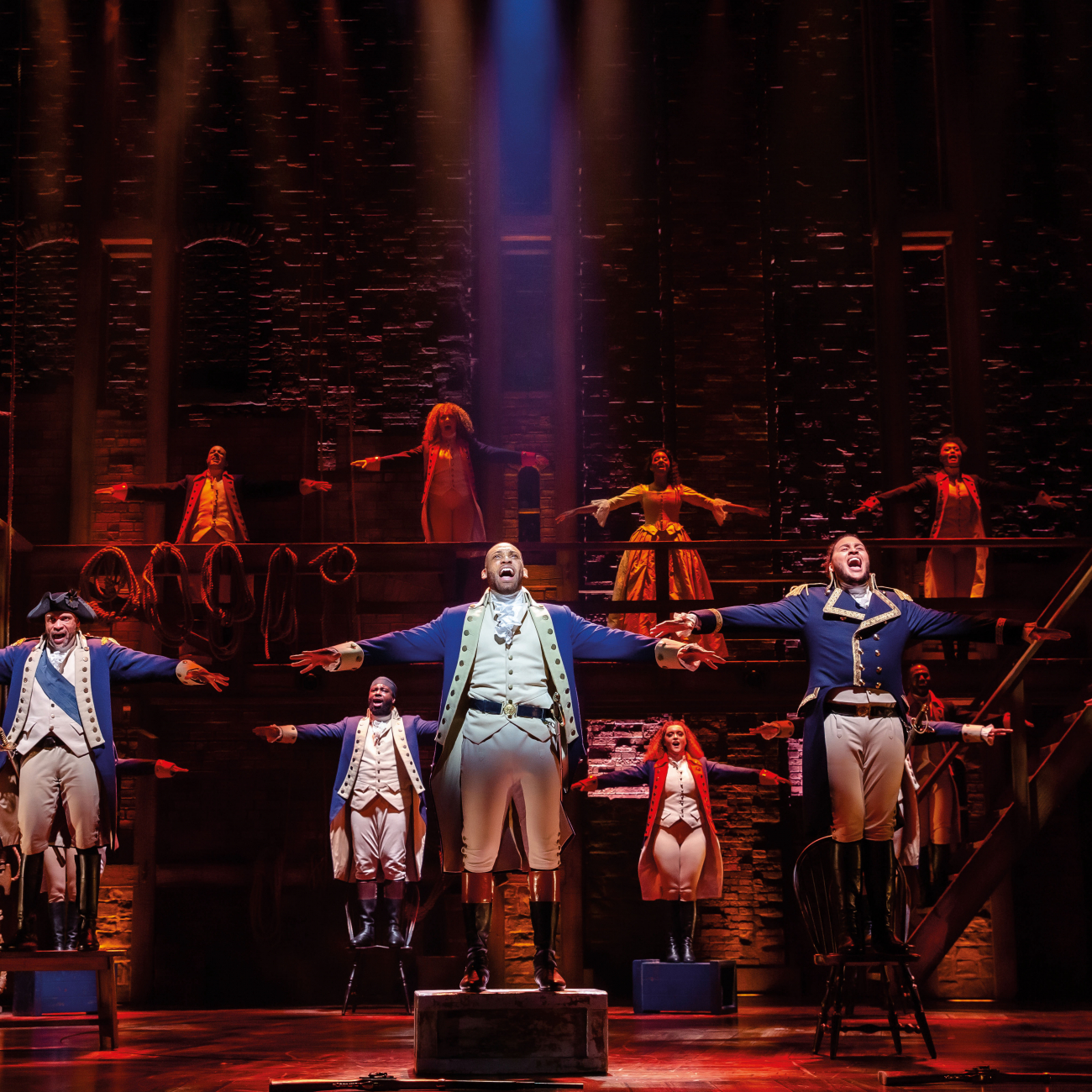 Shaq Taylor on stage as Hamilton in the musical 