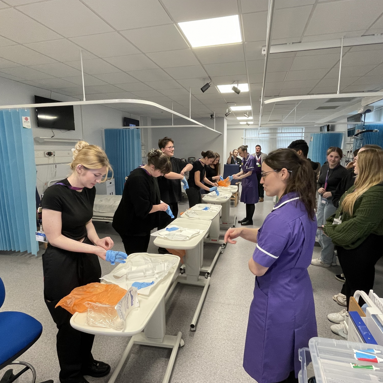 Learners practicing how to open bandages properly