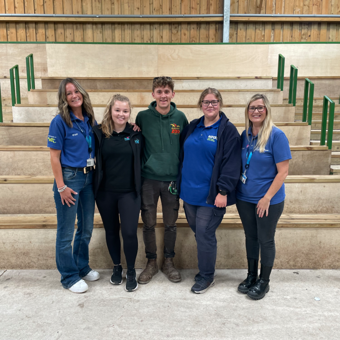 Former students and lecturers smiling together