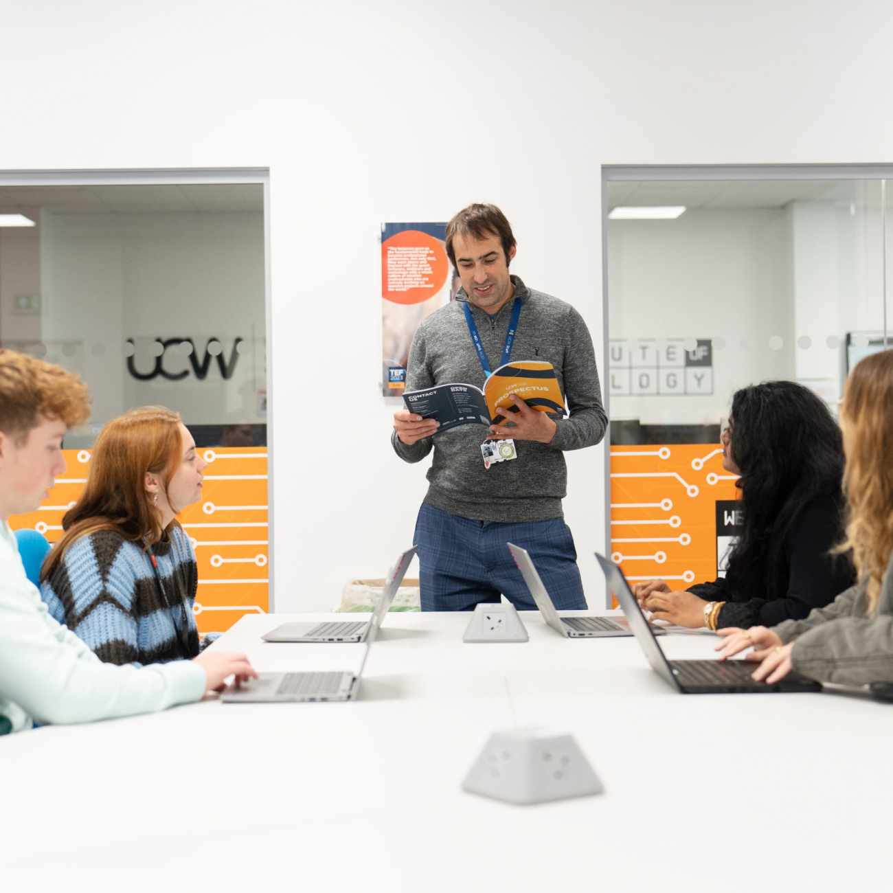 Lecturer discussing UCW