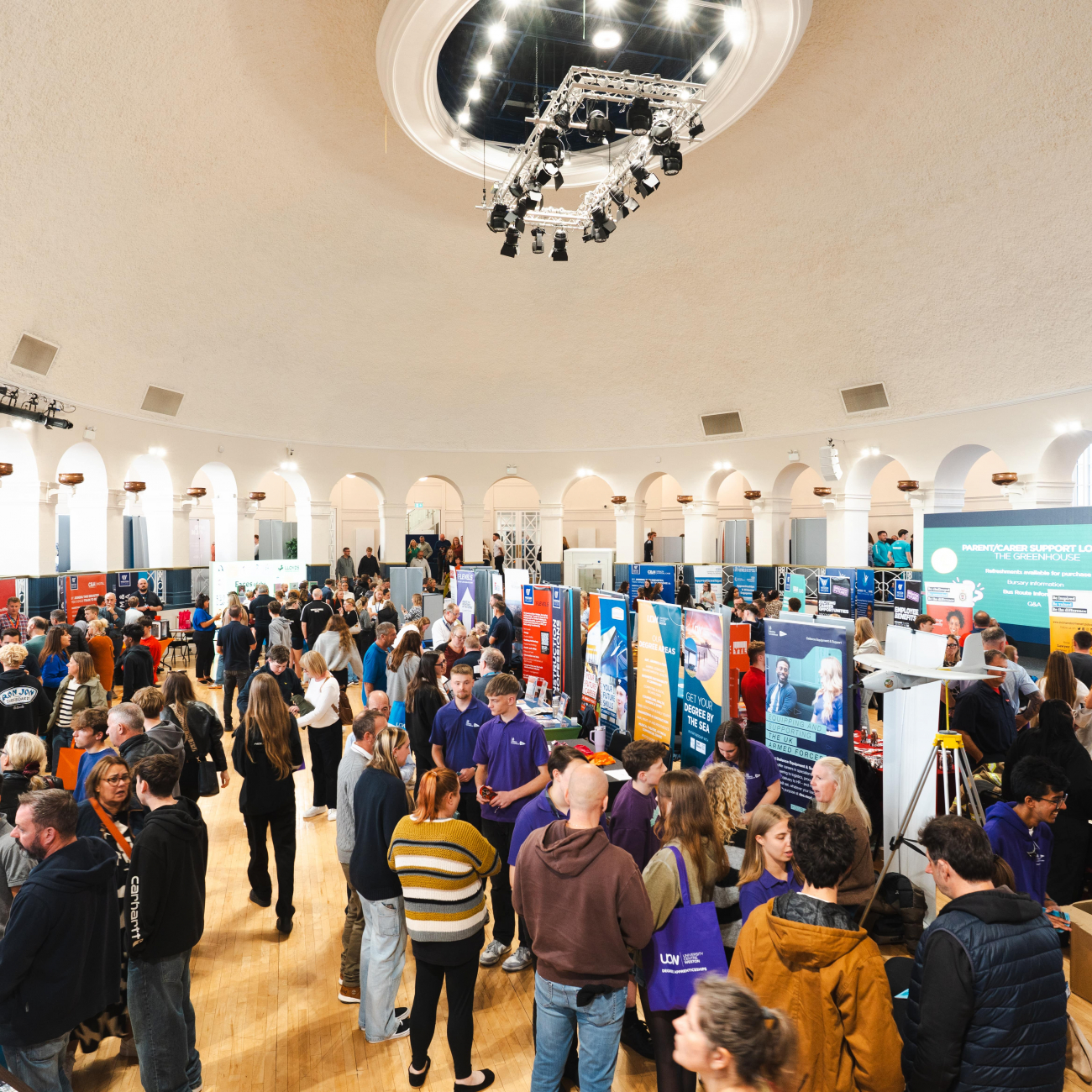 Attendees in Ballroom looking at employer stands