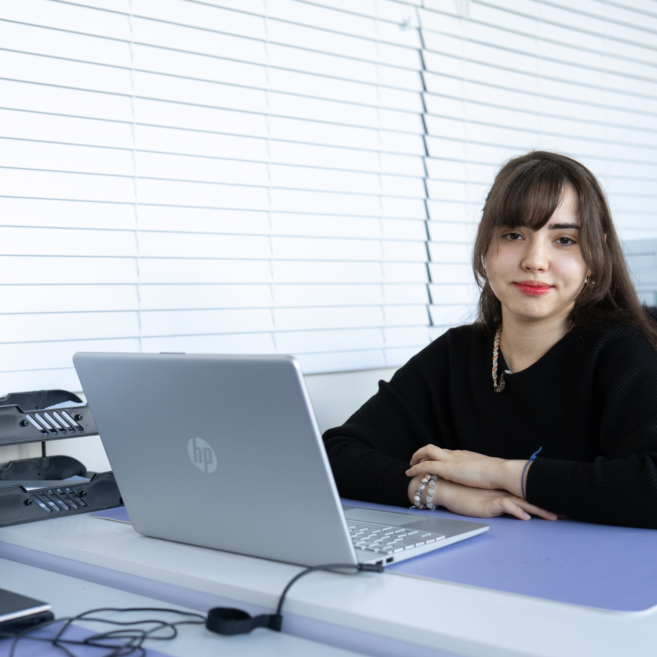 T Level Learner Greta sat behind laptop
