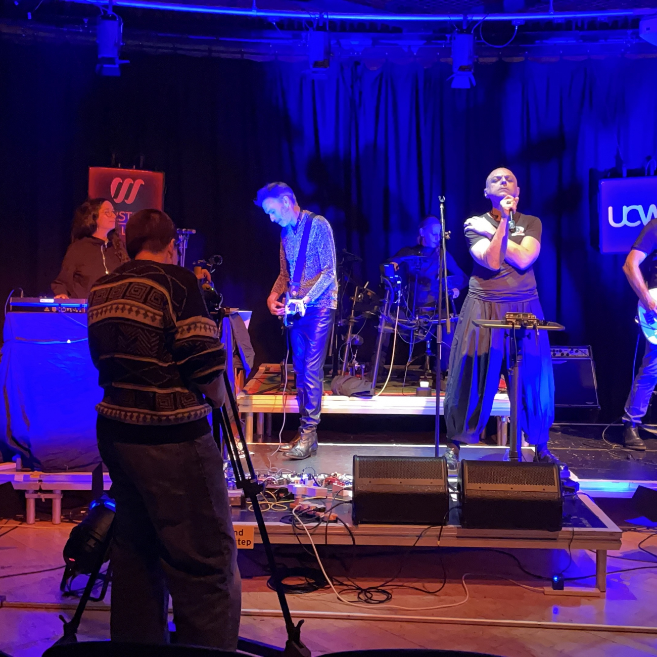 Media student recording the Peripheries whilst they perform